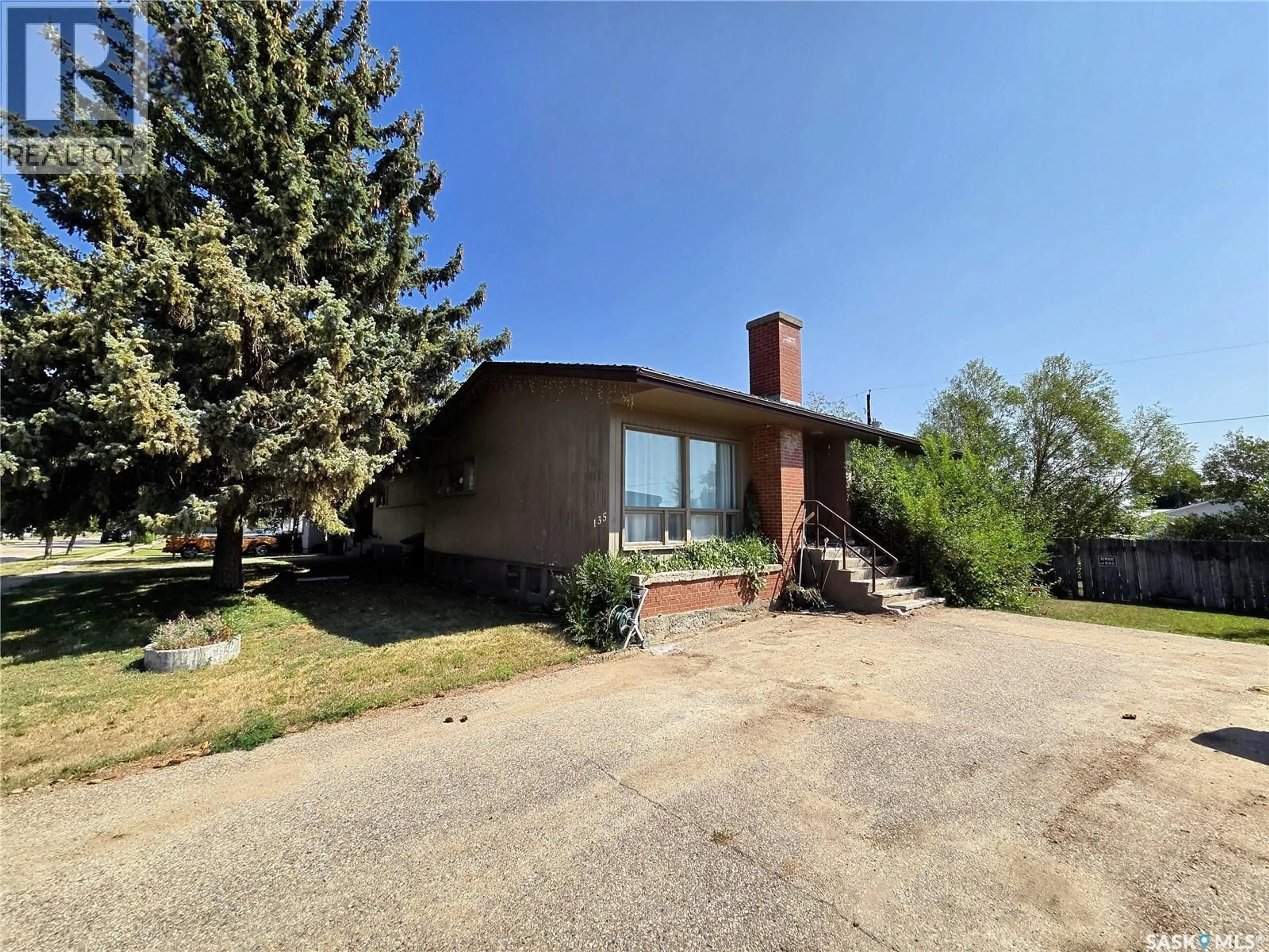 Home with brick exterior material, unknown for E - 135-145 3RD STREET, Fox Valley Saskatchewan S0N0V0