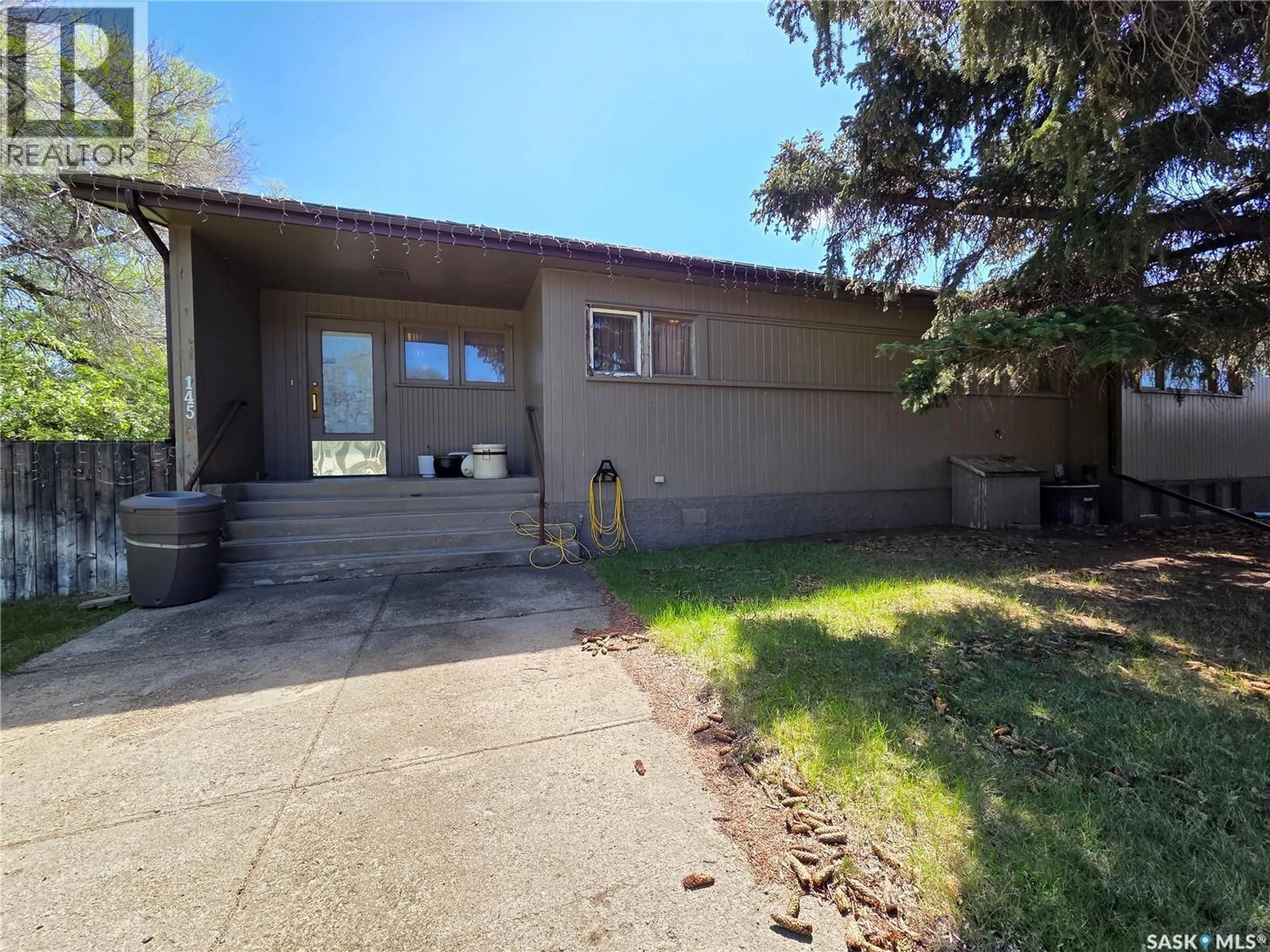 A pic from outside/outdoor area/front of a property/back of a property/a pic from drone, unknown for E - 135-145 3RD STREET, Fox Valley Saskatchewan S0N0V0