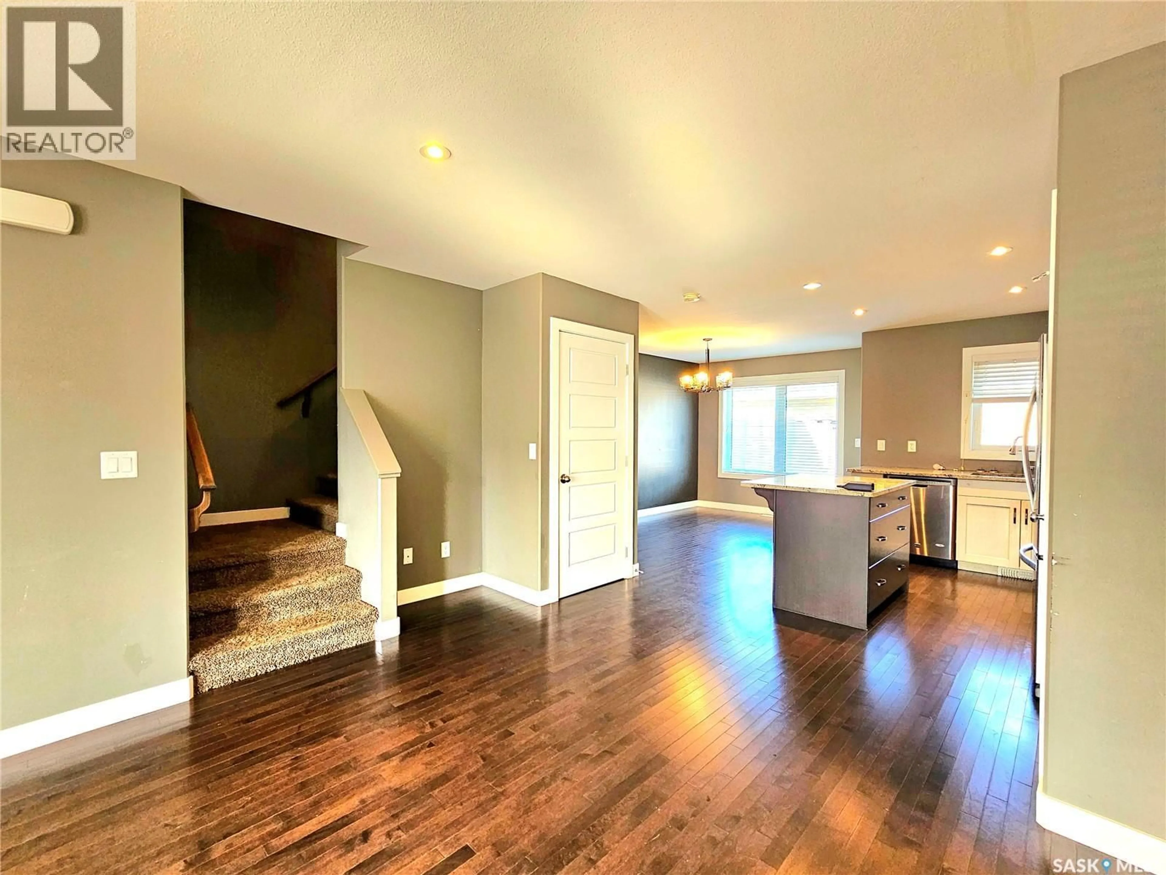 Open concept kitchen, wood/laminate floor for 1415 HUNTER ROAD, Saskatoon Saskatchewan S7T0T4