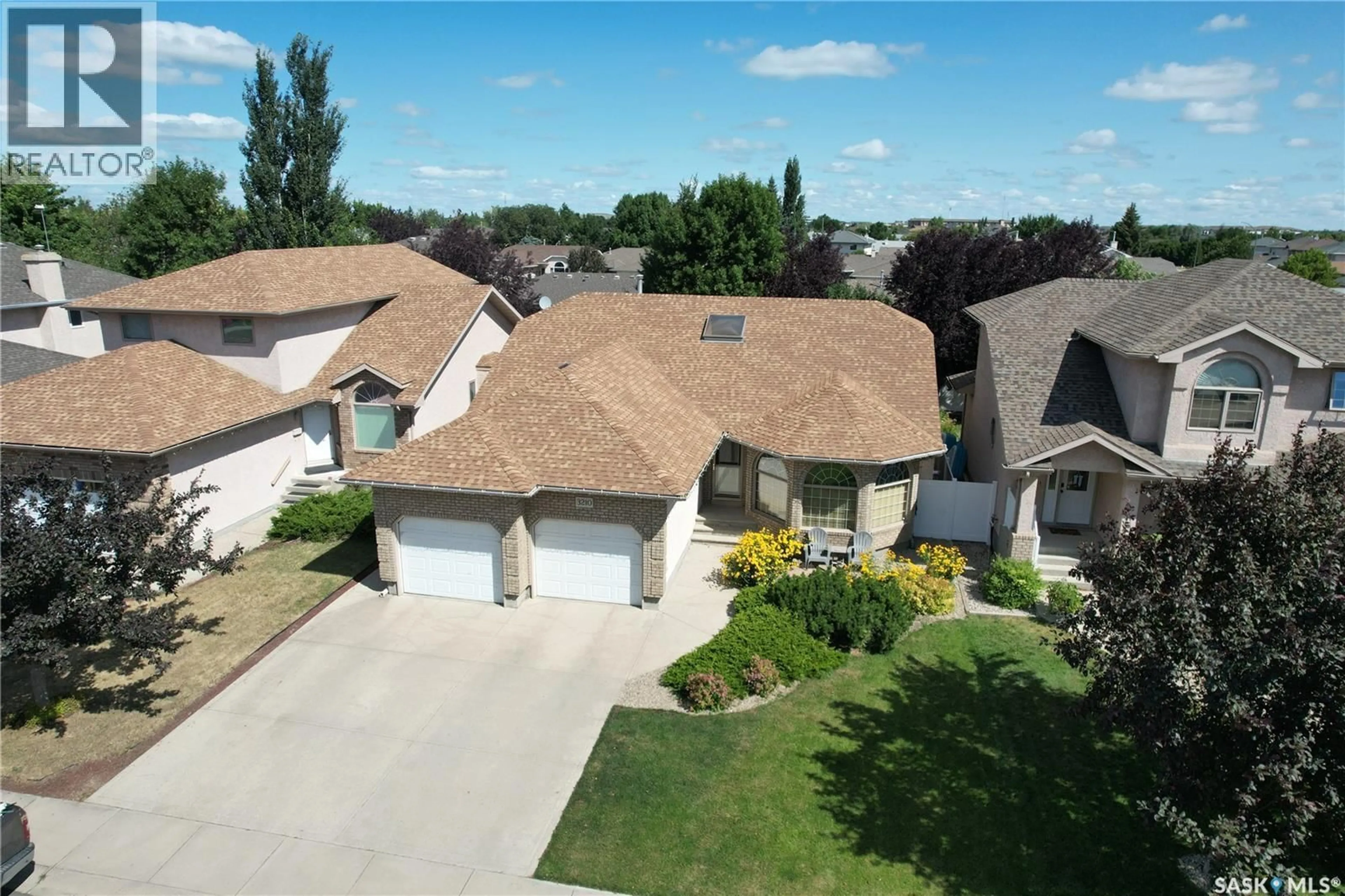 A pic from outside/outdoor area/front of a property/back of a property/a pic from drone, street for E - 3210 PEYSON BAY, Regina Saskatchewan S4V2W8