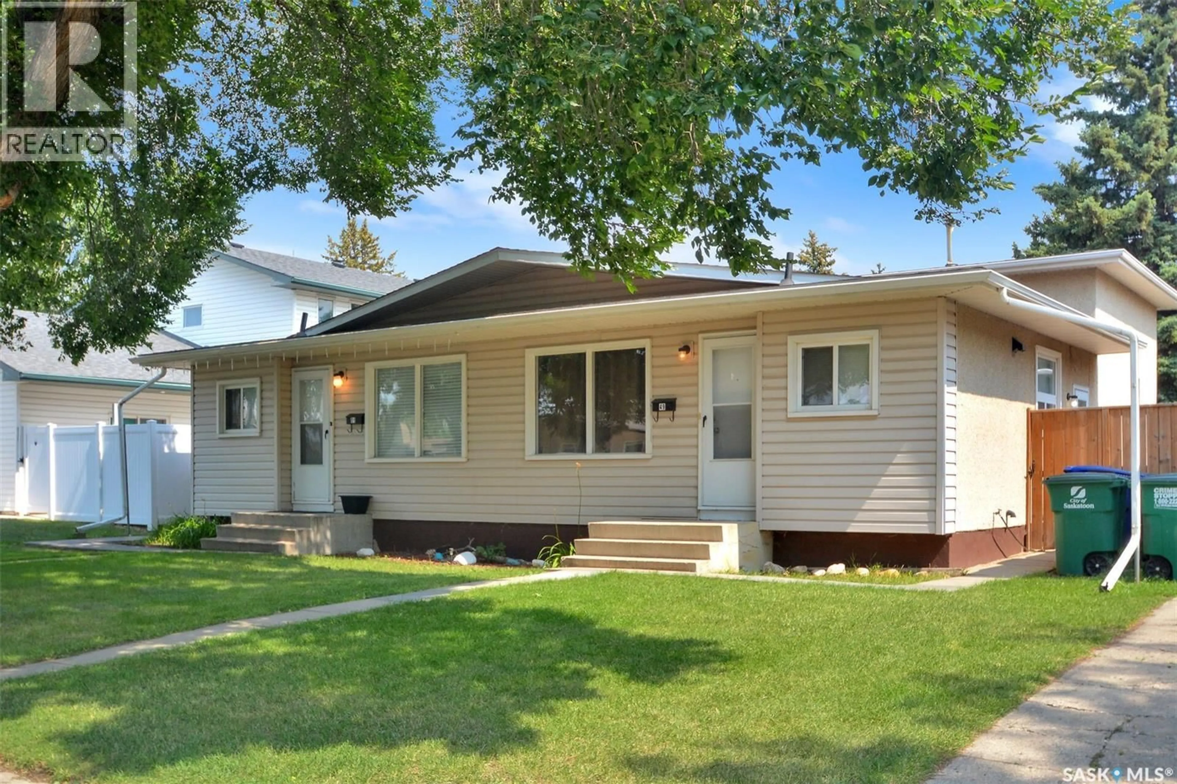 Home with vinyl exterior material, street for 49-51 CARLETON DRIVE, Saskatoon Saskatchewan S7H3N9