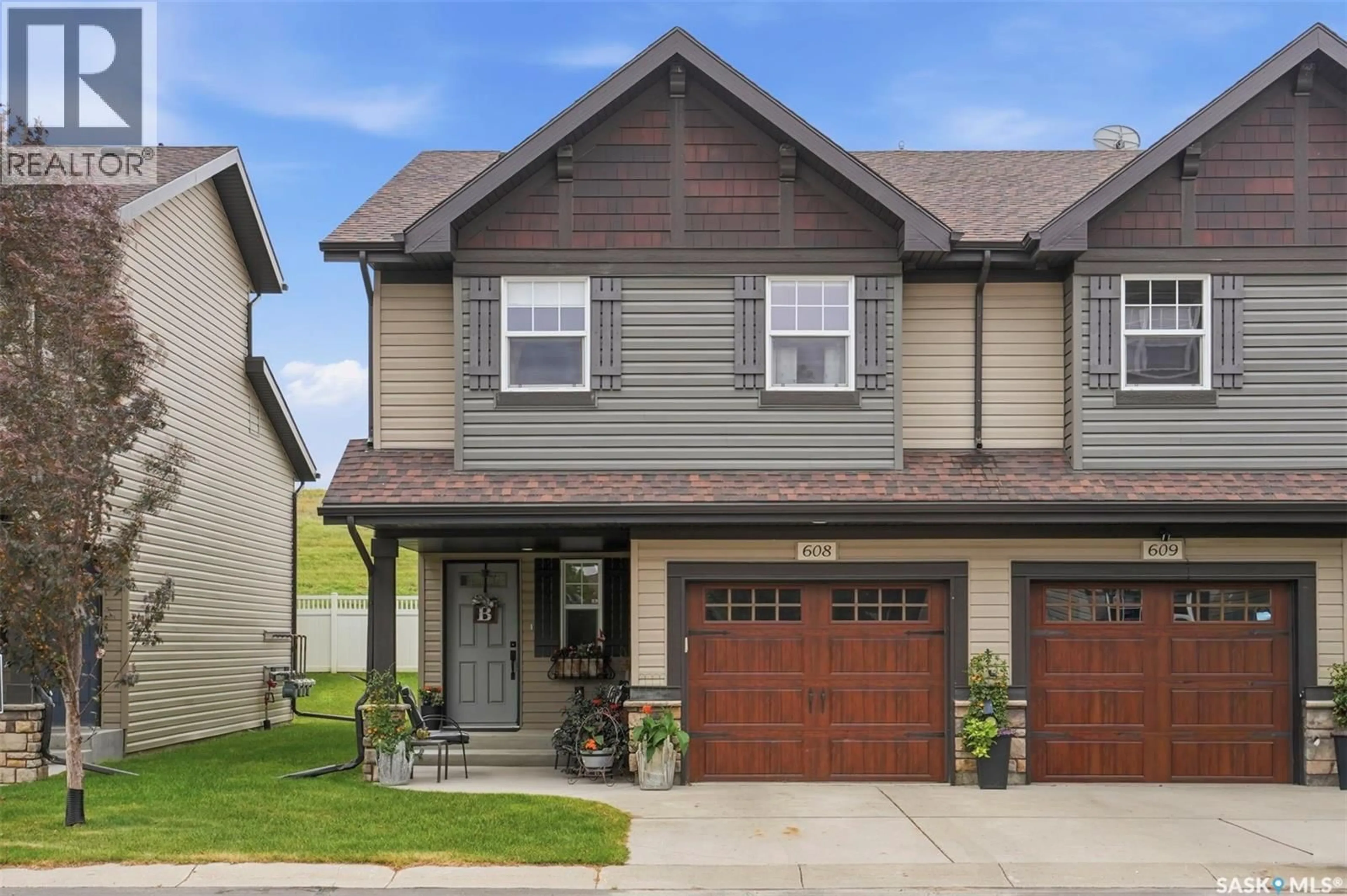 Home with vinyl exterior material, street for 150 - 608 LANGLOIS WAY, Saskatoon Saskatchewan S7T1C8