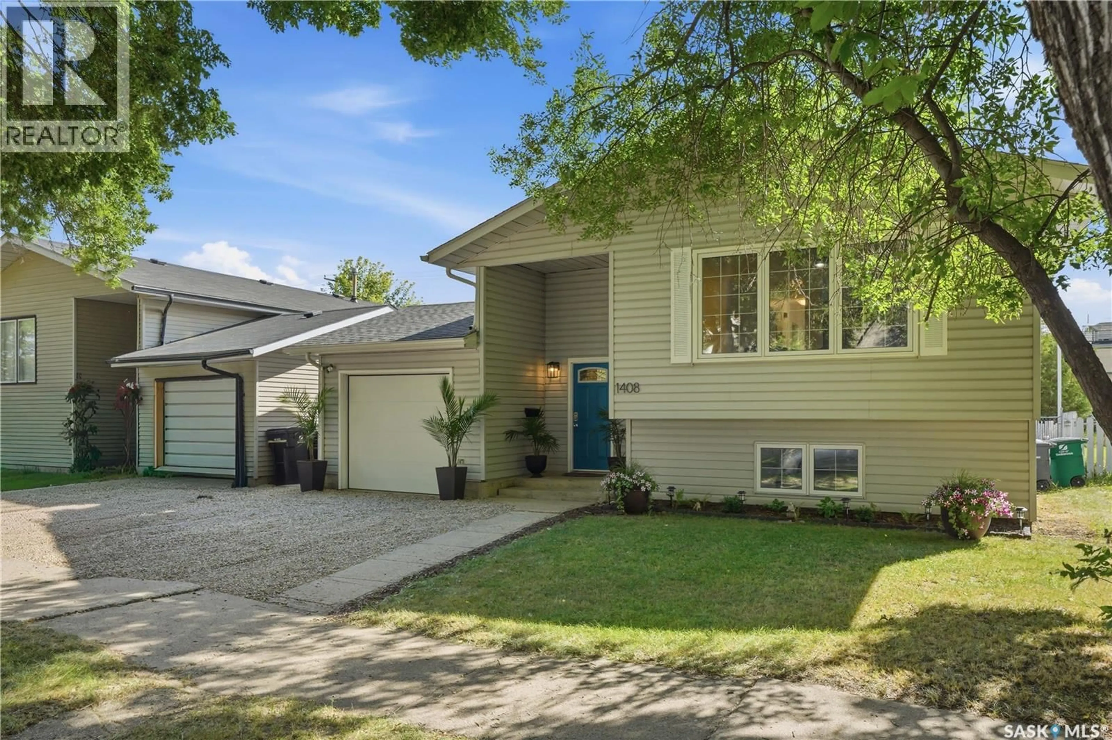 Home with vinyl exterior material, street for 1408 B AVENUE, Saskatoon Saskatchewan S7L1G8