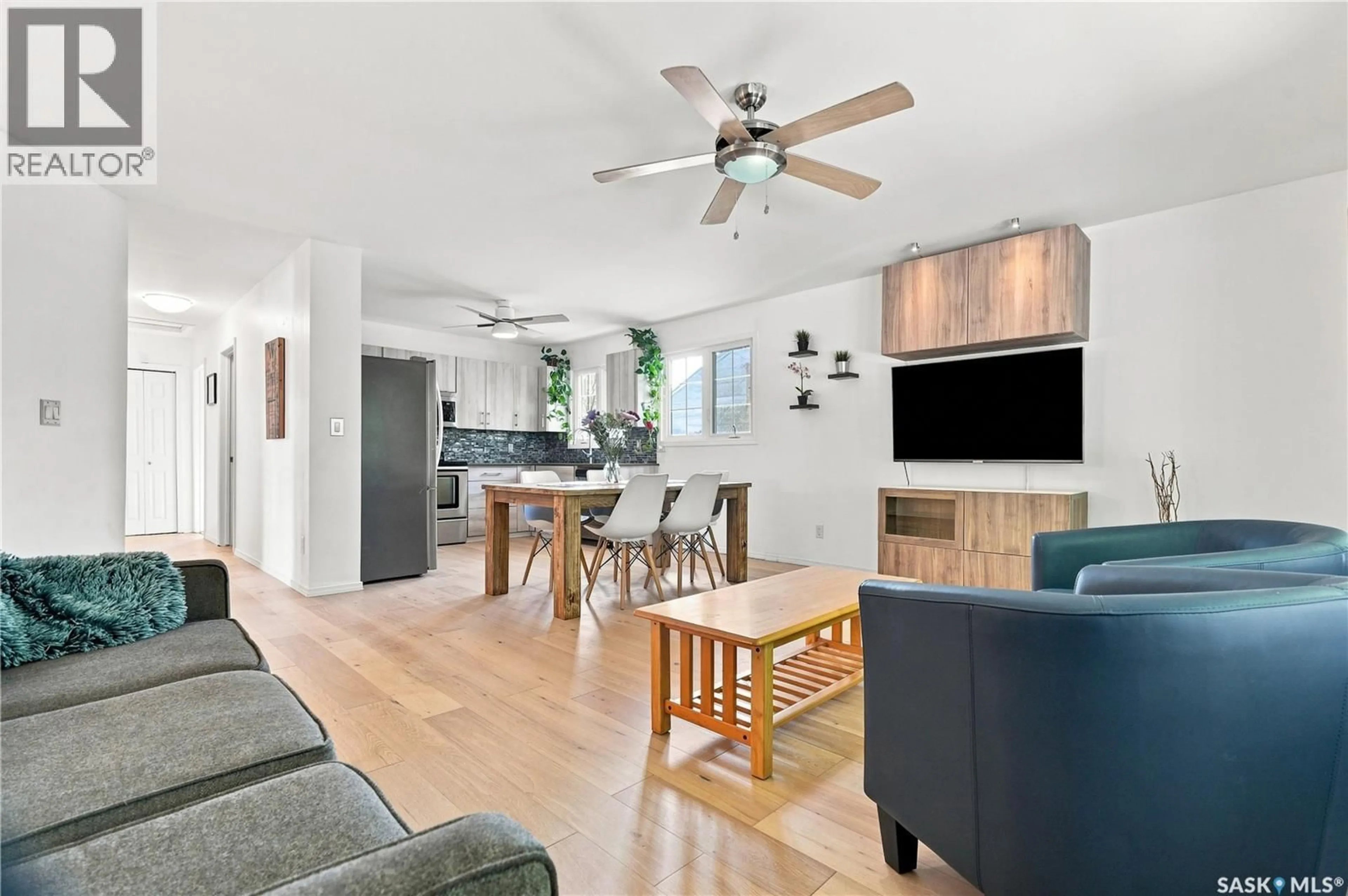 Open concept kitchen, wood/laminate floor for 1408 B AVENUE, Saskatoon Saskatchewan S7L1G8