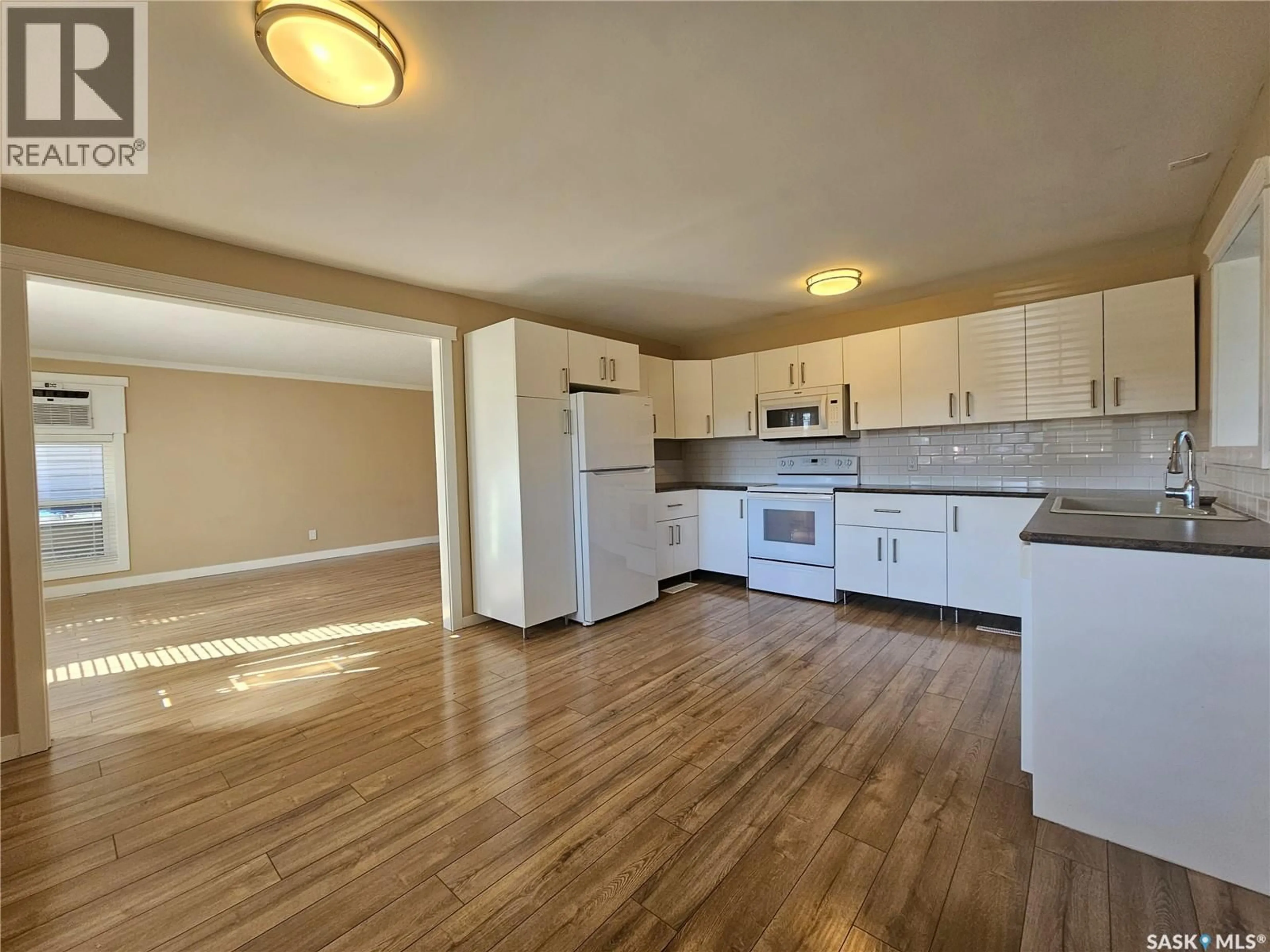 Standard kitchen, wood/laminate floor for 1971 99TH STREET, North Battleford Saskatchewan S9A0S1