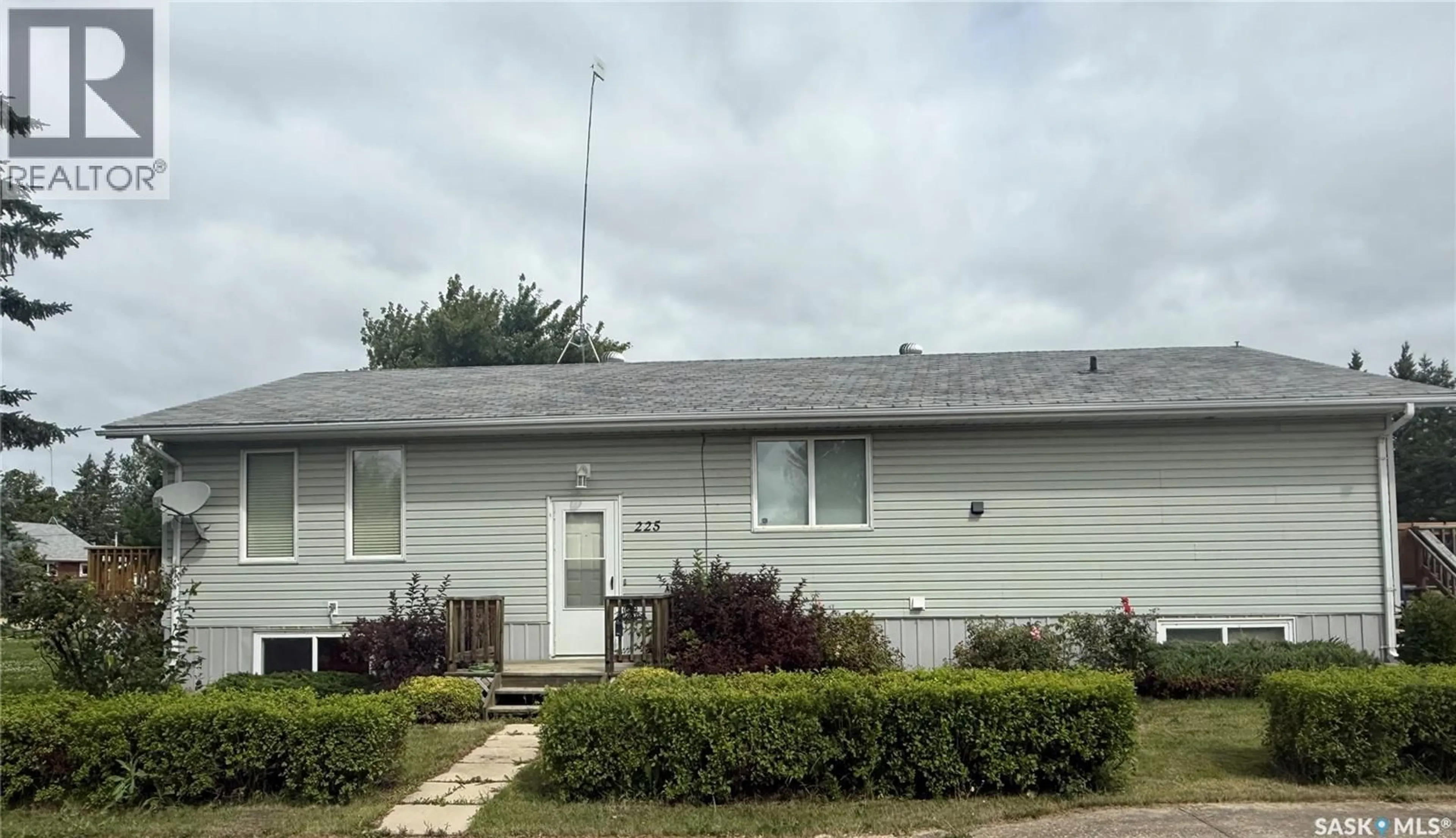 Home with vinyl exterior material, street for 225 1ST STREET, Beatty Saskatchewan S0J0C0