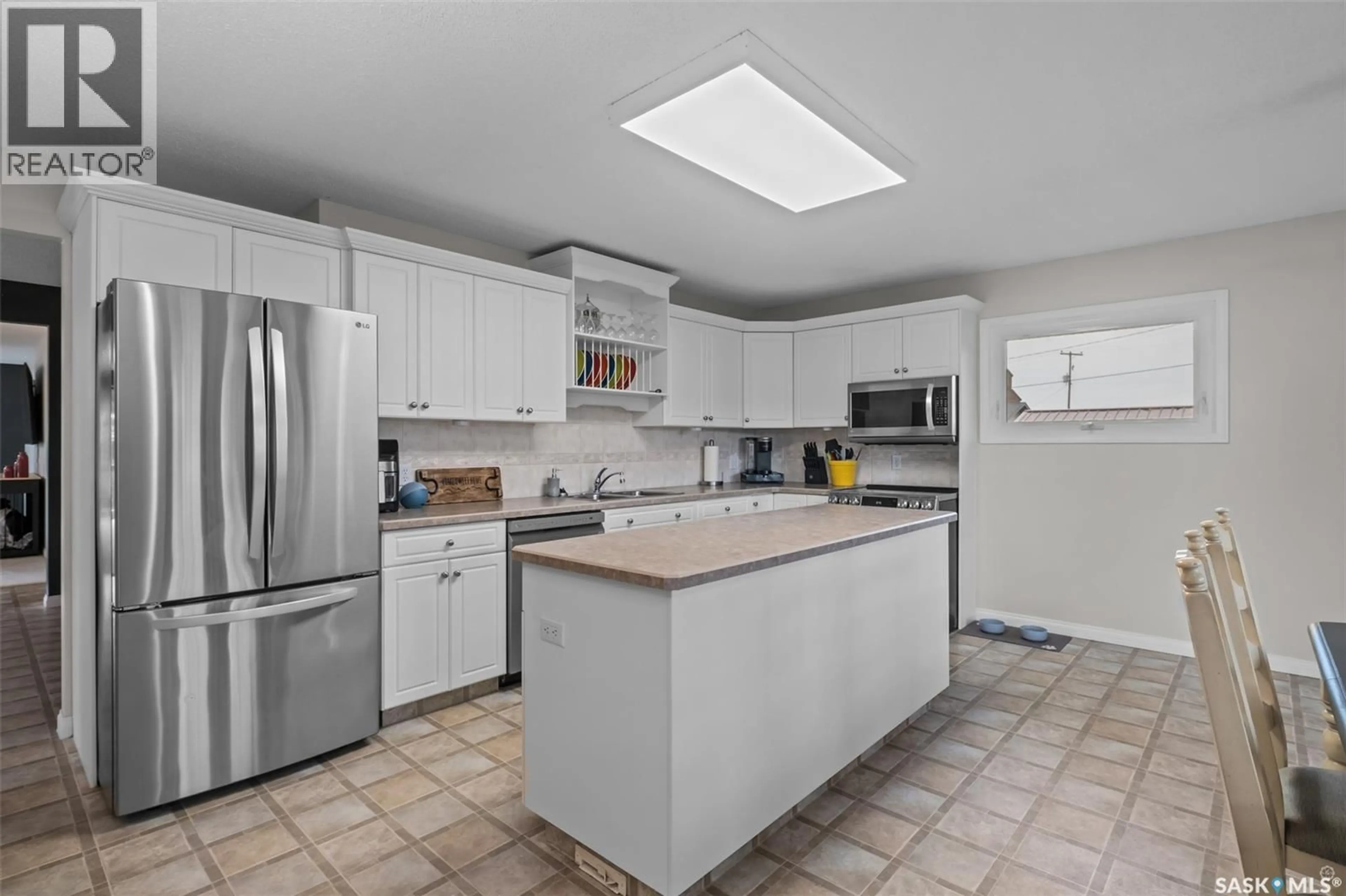 Open concept kitchen, ceramic/tile floor for 225 1ST STREET, Beatty Saskatchewan S0J0C0