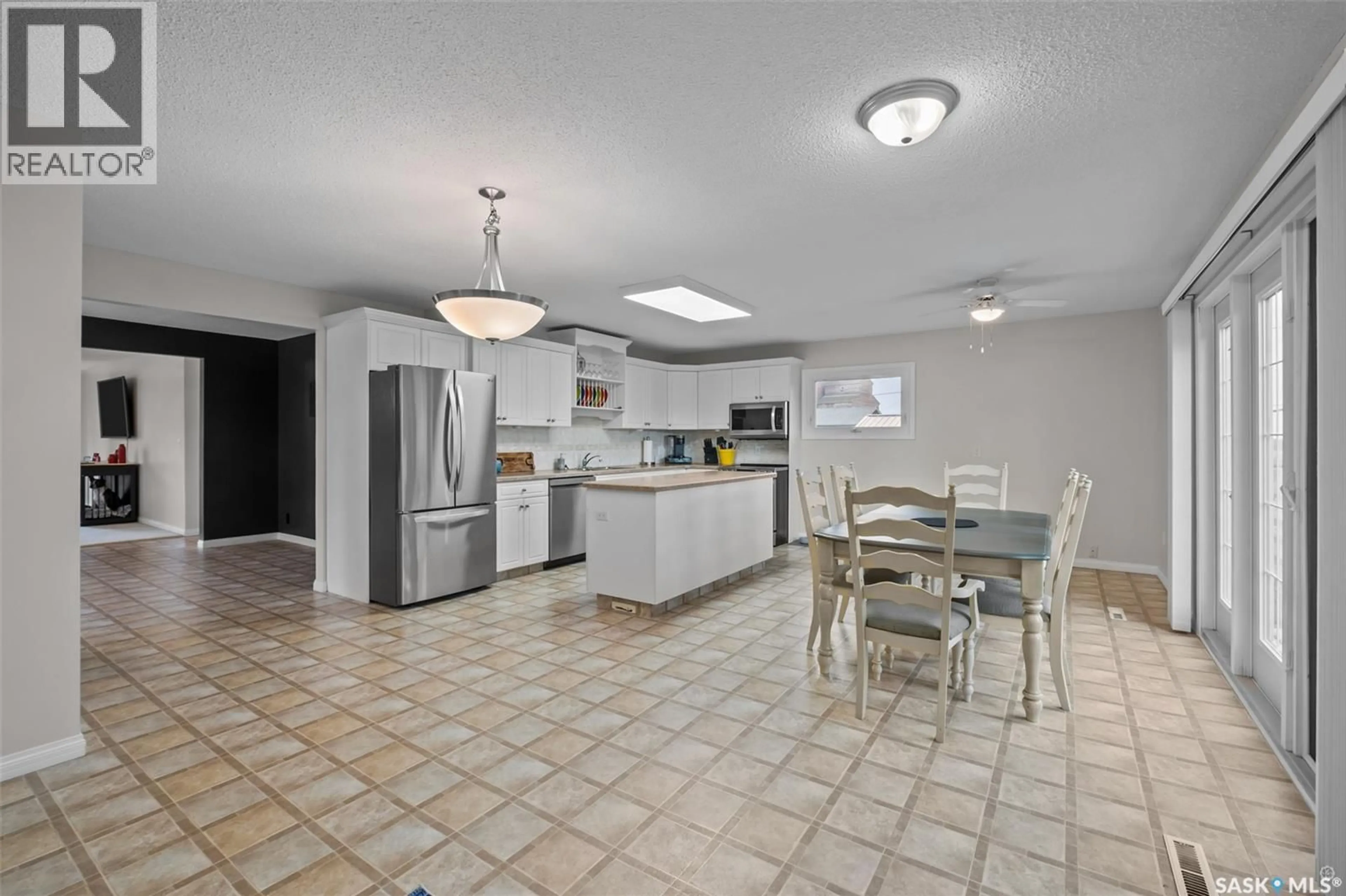 Open concept kitchen, ceramic/tile floor for 225 1ST STREET, Beatty Saskatchewan S0J0C0
