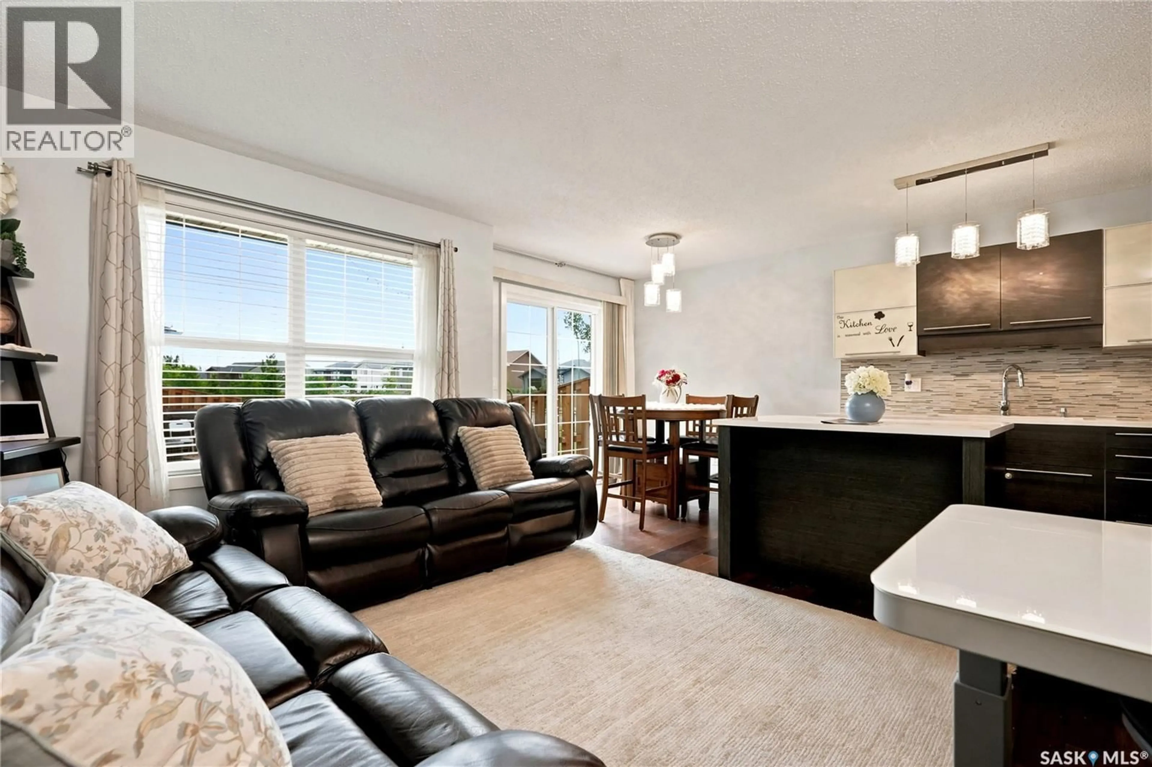 Living room with furniture, unknown for 102 - 410 LEDINGHAM WAY, Saskatoon Saskatchewan S7V0C4