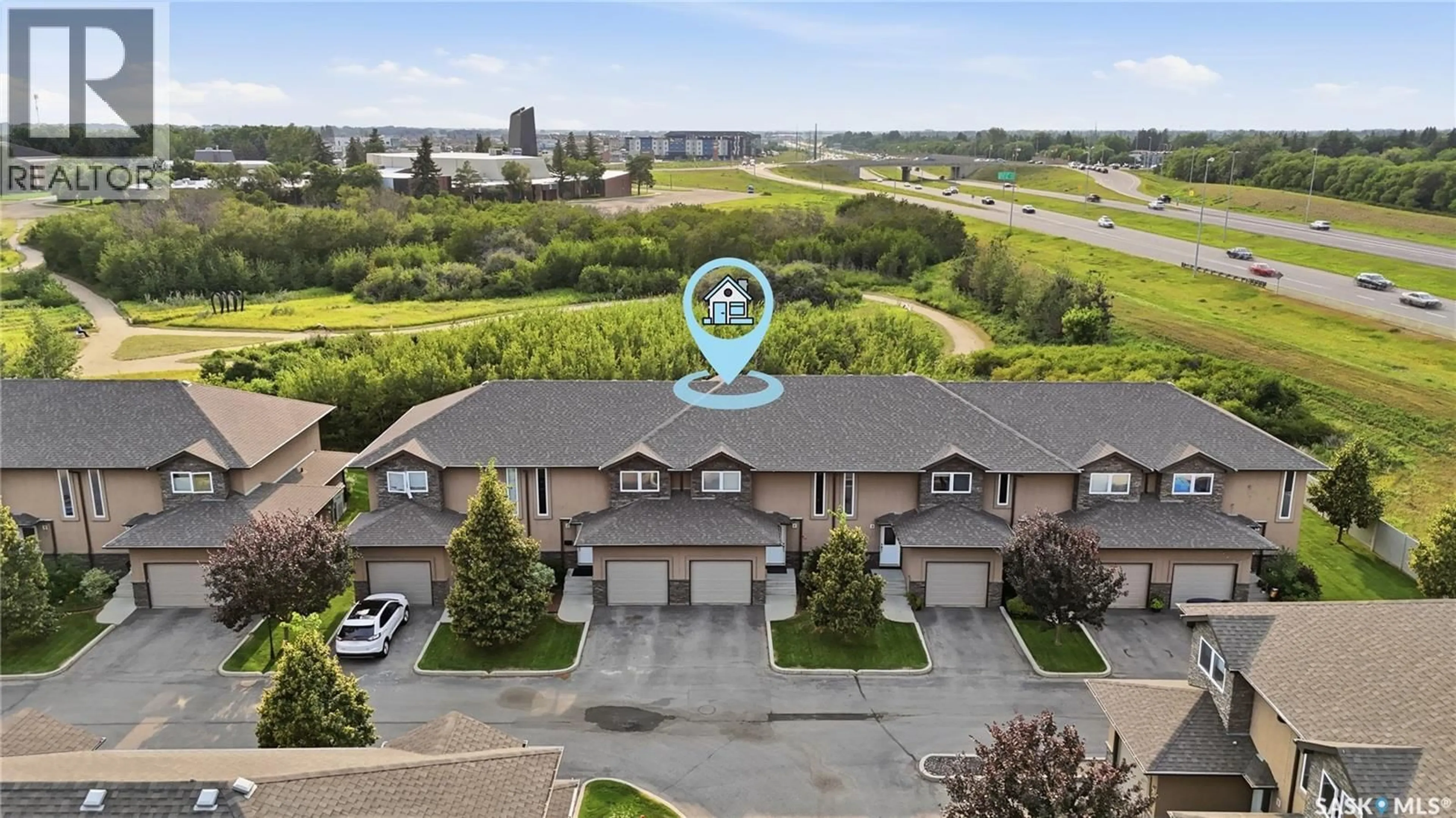 A pic from outside/outdoor area/front of a property/back of a property/a pic from drone, water/lake/river/ocean view for 502 - 14 REMPEL MANOR, Saskatoon Saskatchewan S7T0L7