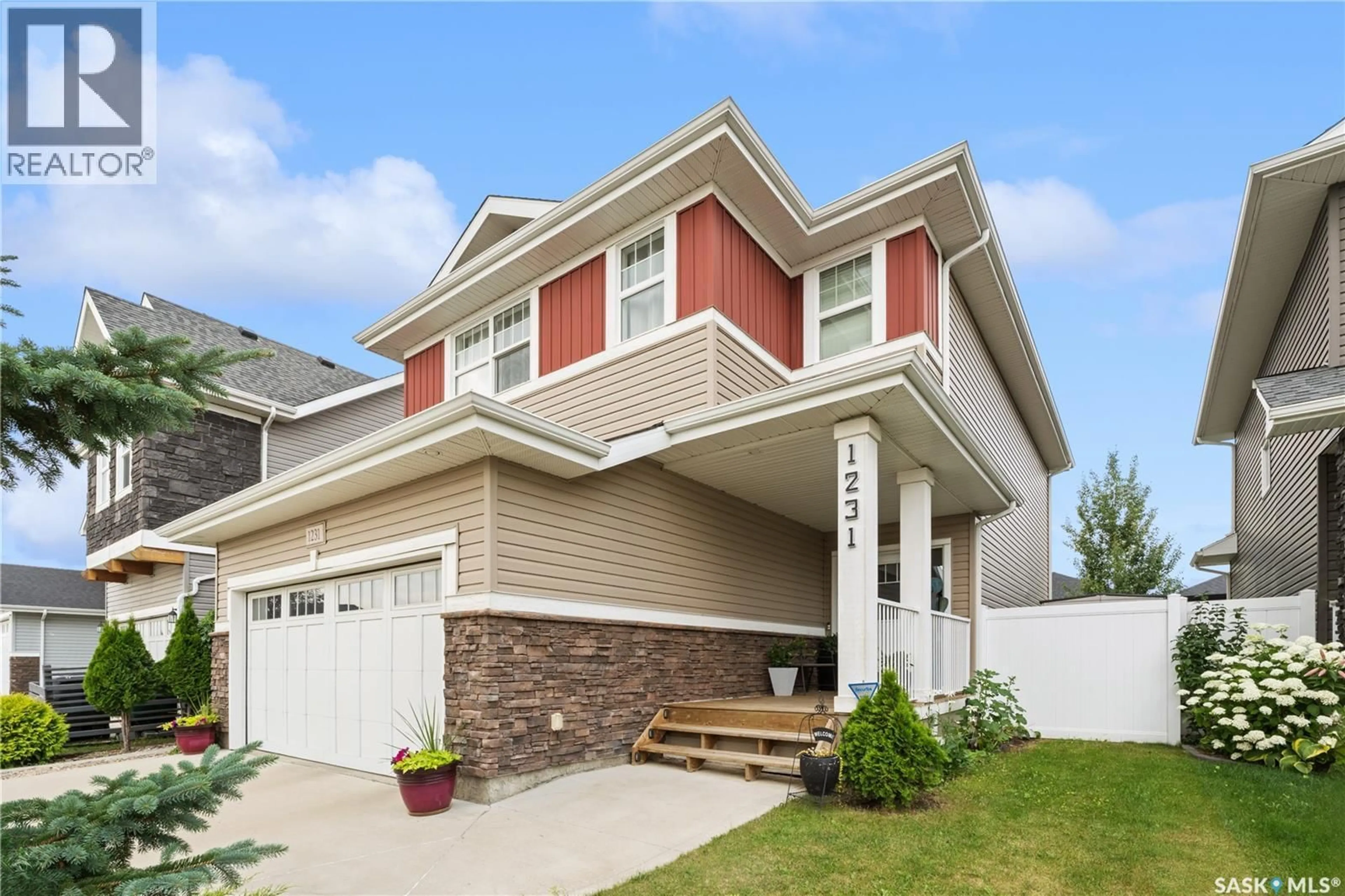 Home with vinyl exterior material, street for 1231 PRINGLE WAY, Saskatoon Saskatchewan S7T1C9