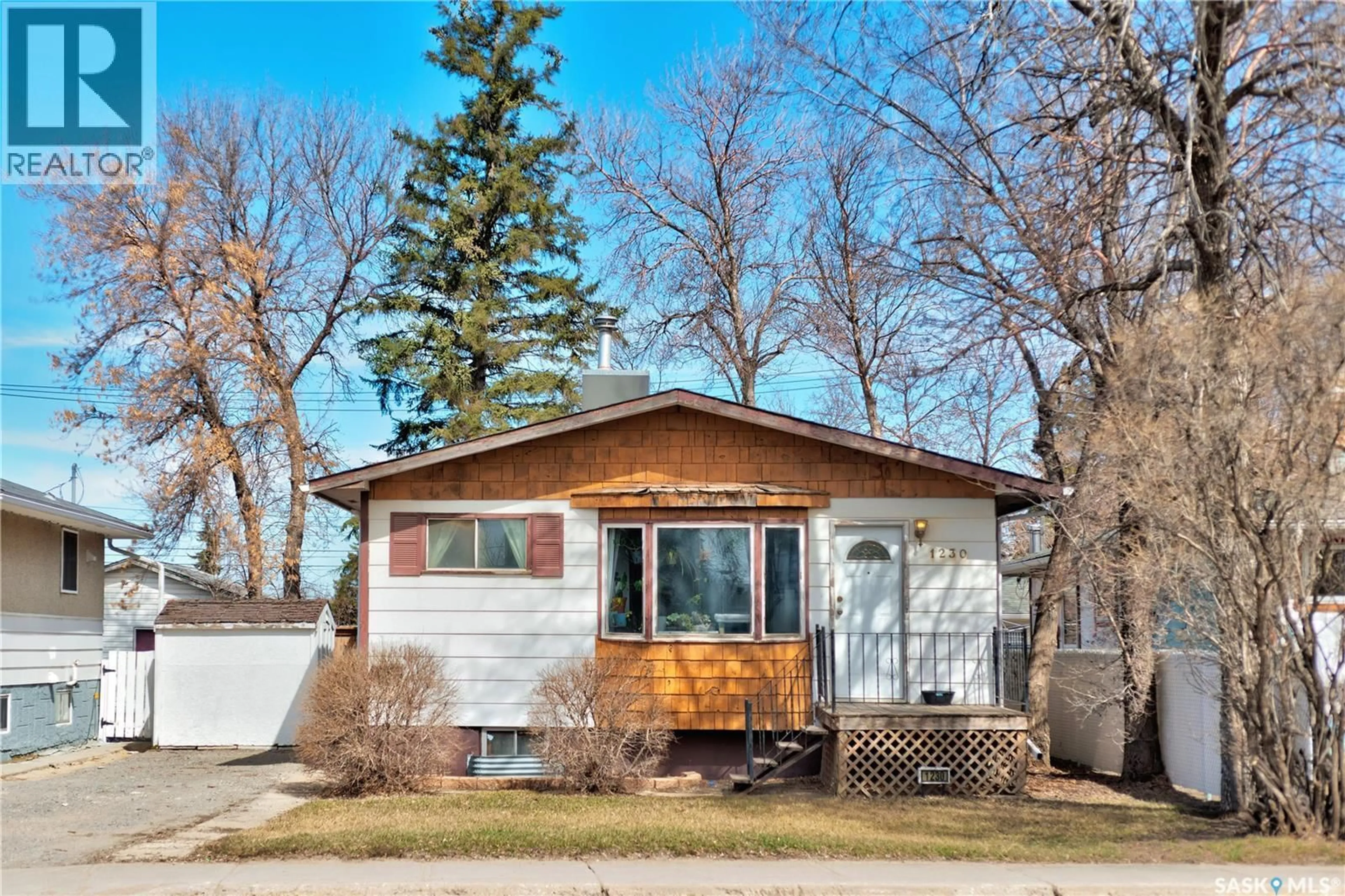 Home with vinyl exterior material, street for 1230 DEWDNEY AVENUE, Regina Saskatchewan S4N0E3