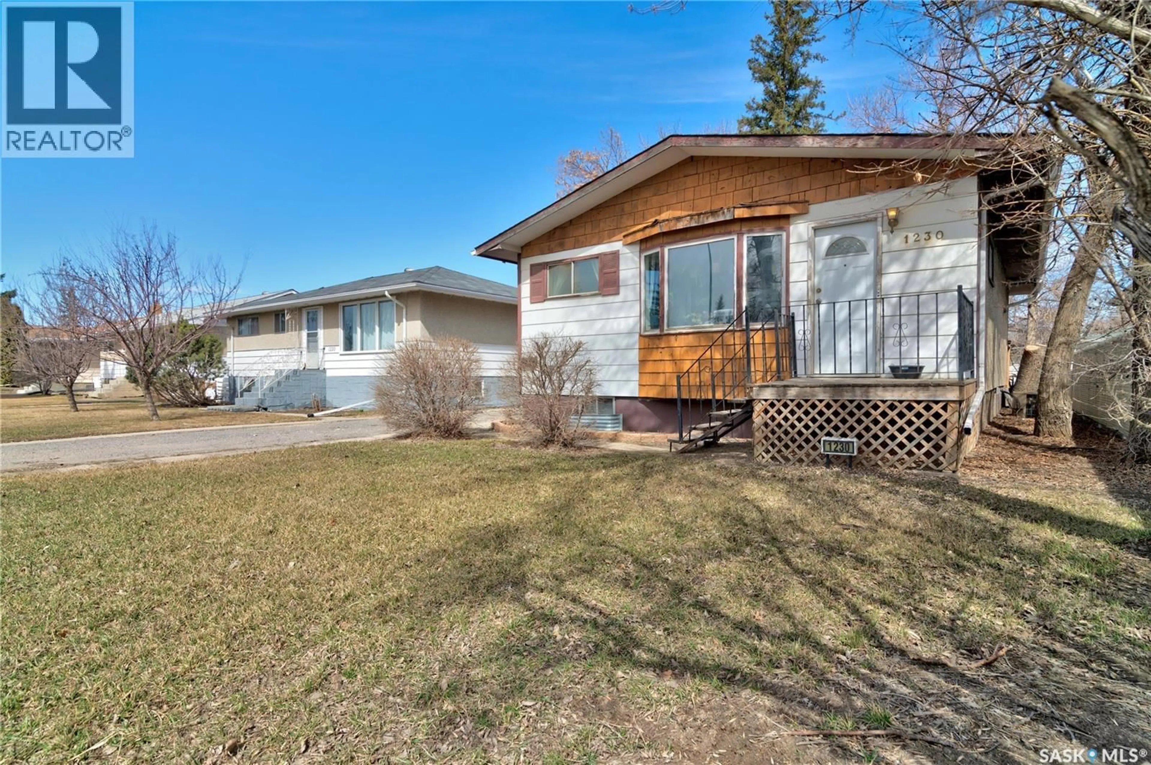 Home with vinyl exterior material, street for 1230 DEWDNEY AVENUE, Regina Saskatchewan S4N0E3