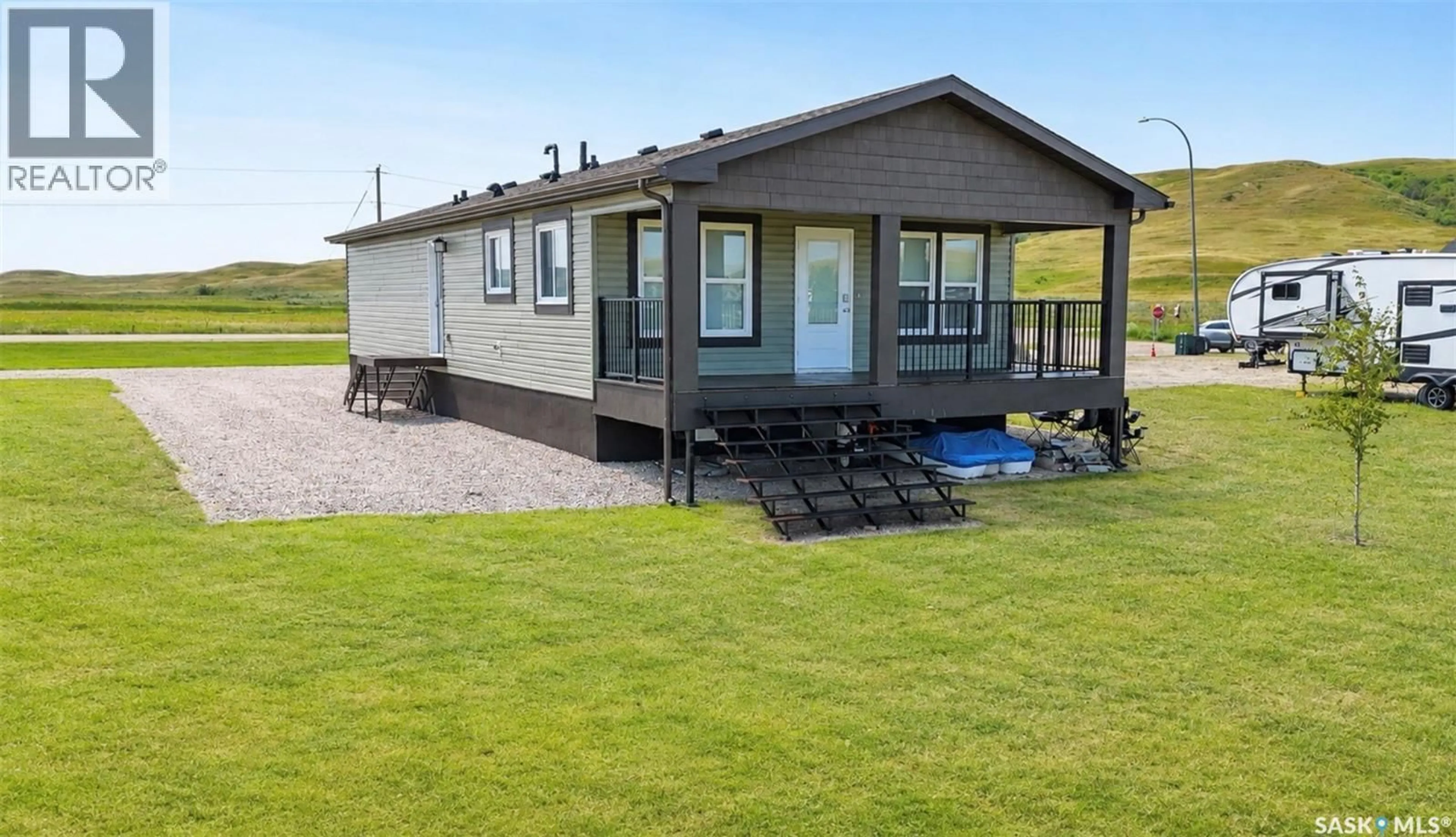 A pic from outside/outdoor area/front of a property/back of a property/a pic from drone, street for 304 MARINA DRIVE, Lac Pelletier Saskatchewan S0N2Y0