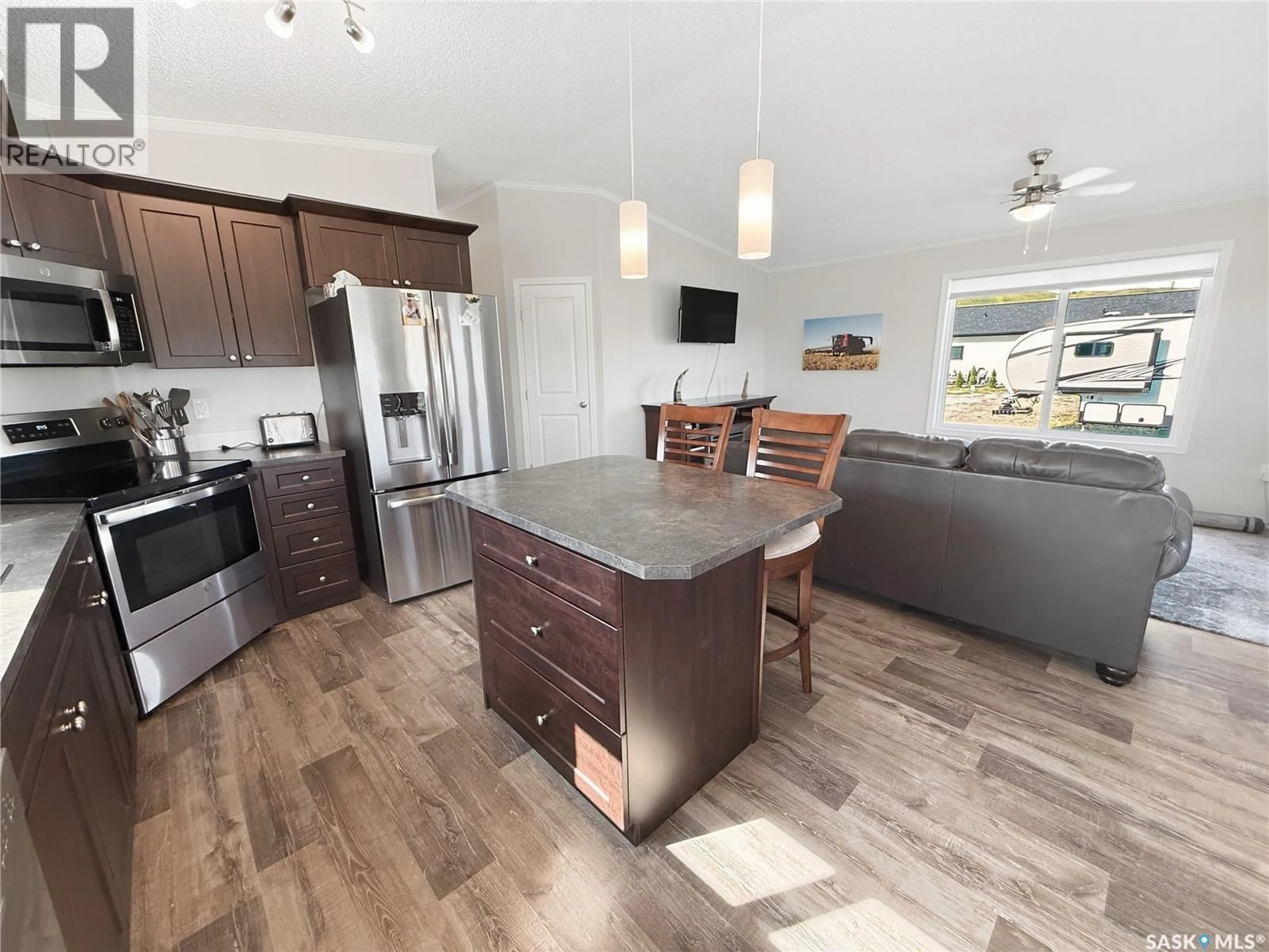Open concept kitchen, wood/laminate floor for 304 MARINA DRIVE, Lac Pelletier Saskatchewan S0N2Y0