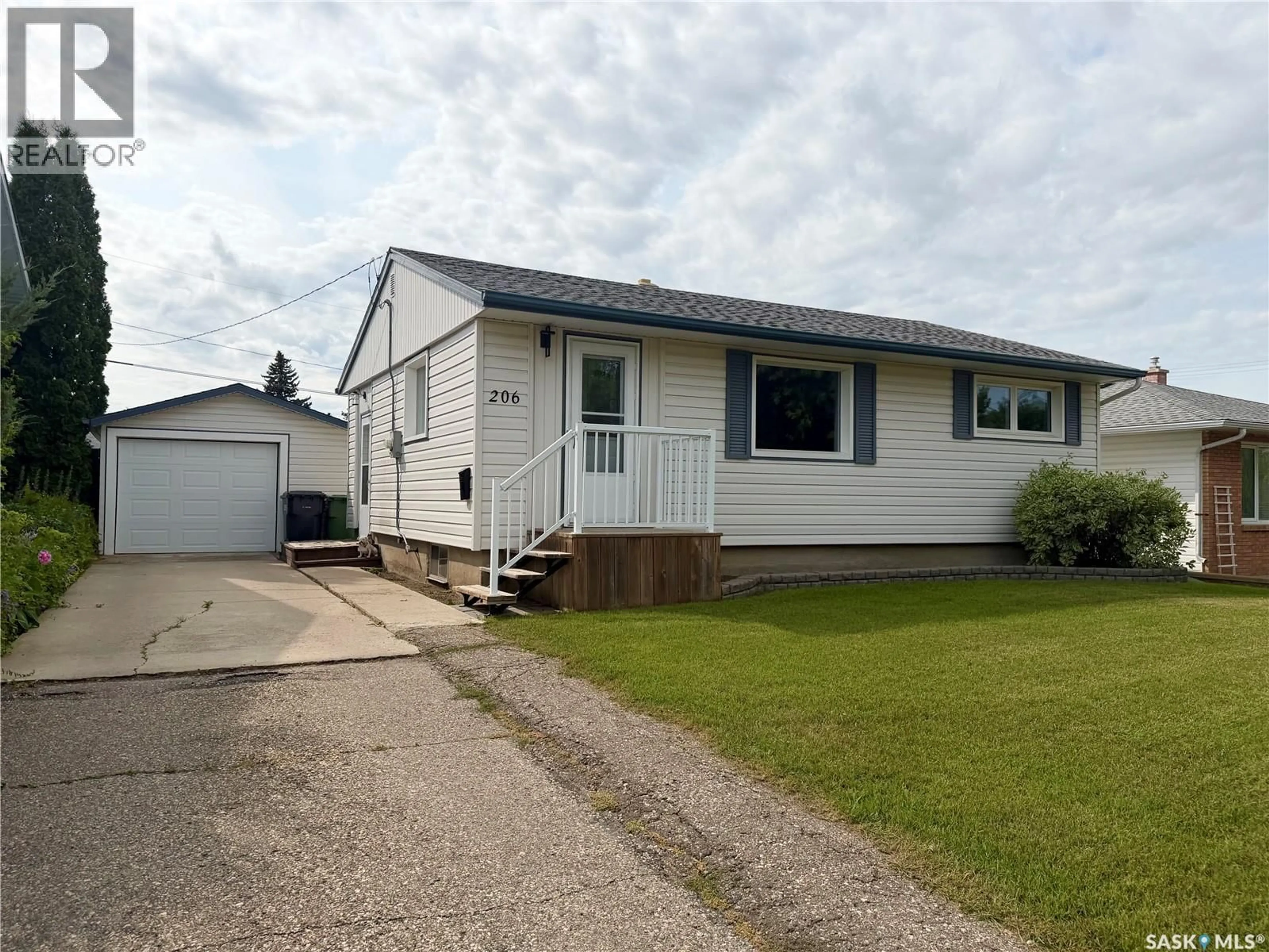 Home with vinyl exterior material, street for 206 THIRD AVENUE, Yorkton Saskatchewan S3N1E8