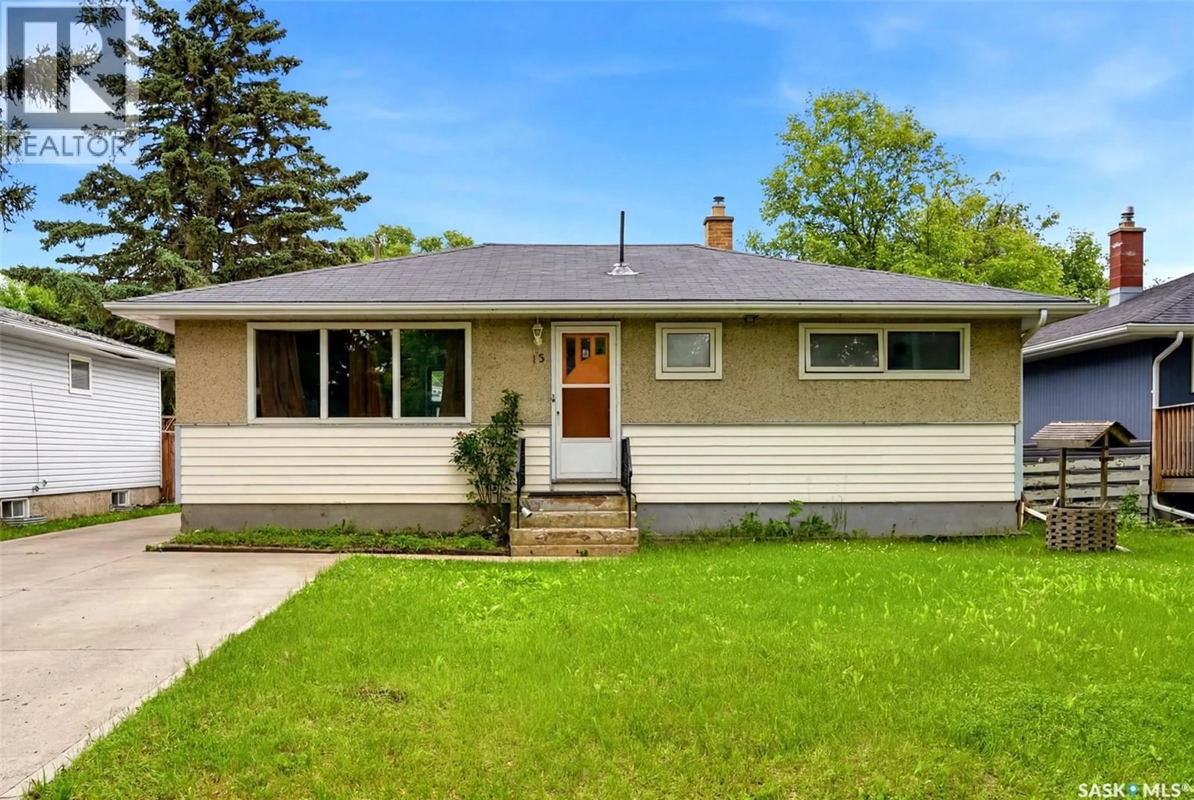 Home with vinyl exterior material, street for 15 OTTAWA PLACE, Regina Saskatchewan S4R2V6