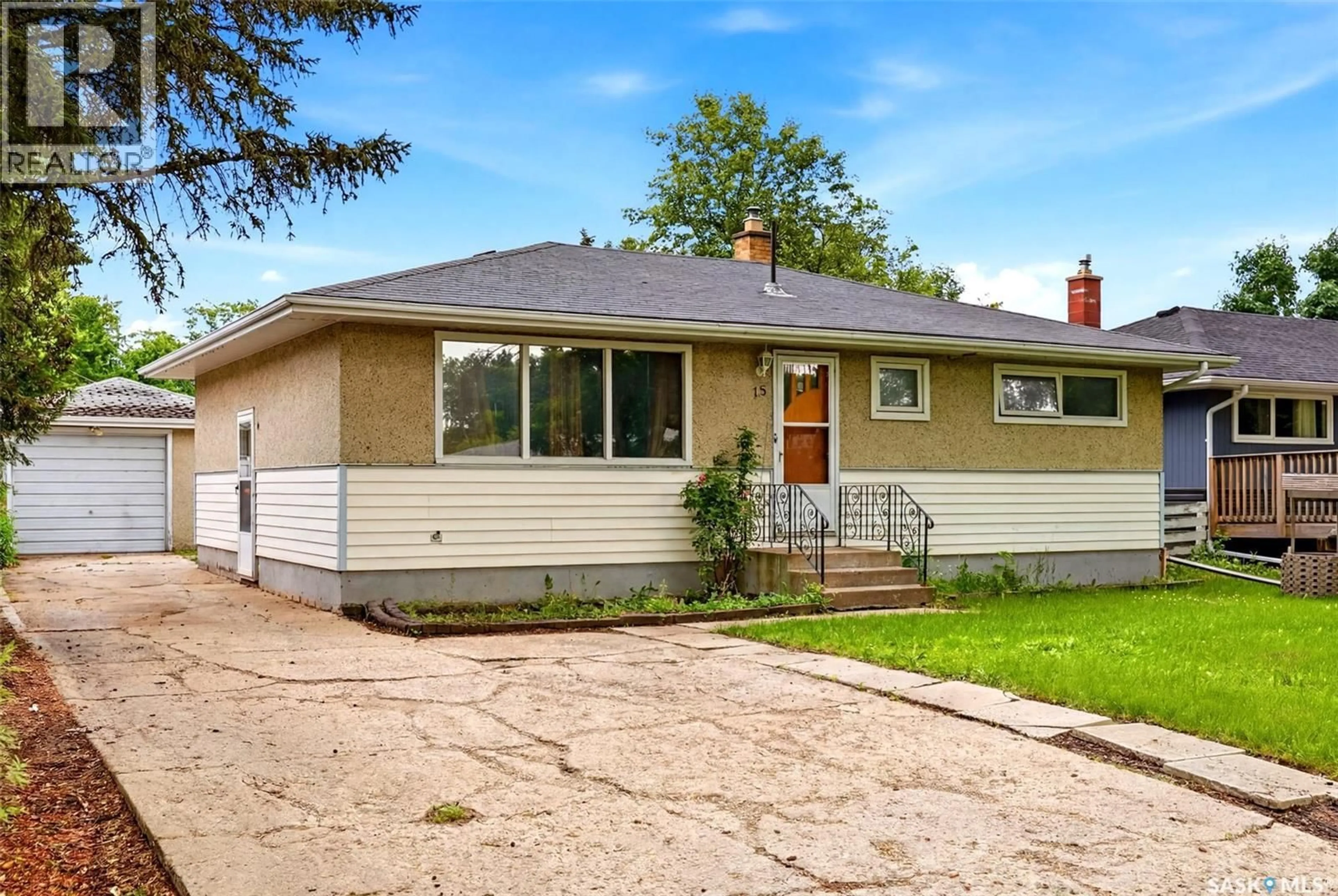 Home with vinyl exterior material, street for 15 OTTAWA PLACE, Regina Saskatchewan S4R2V6