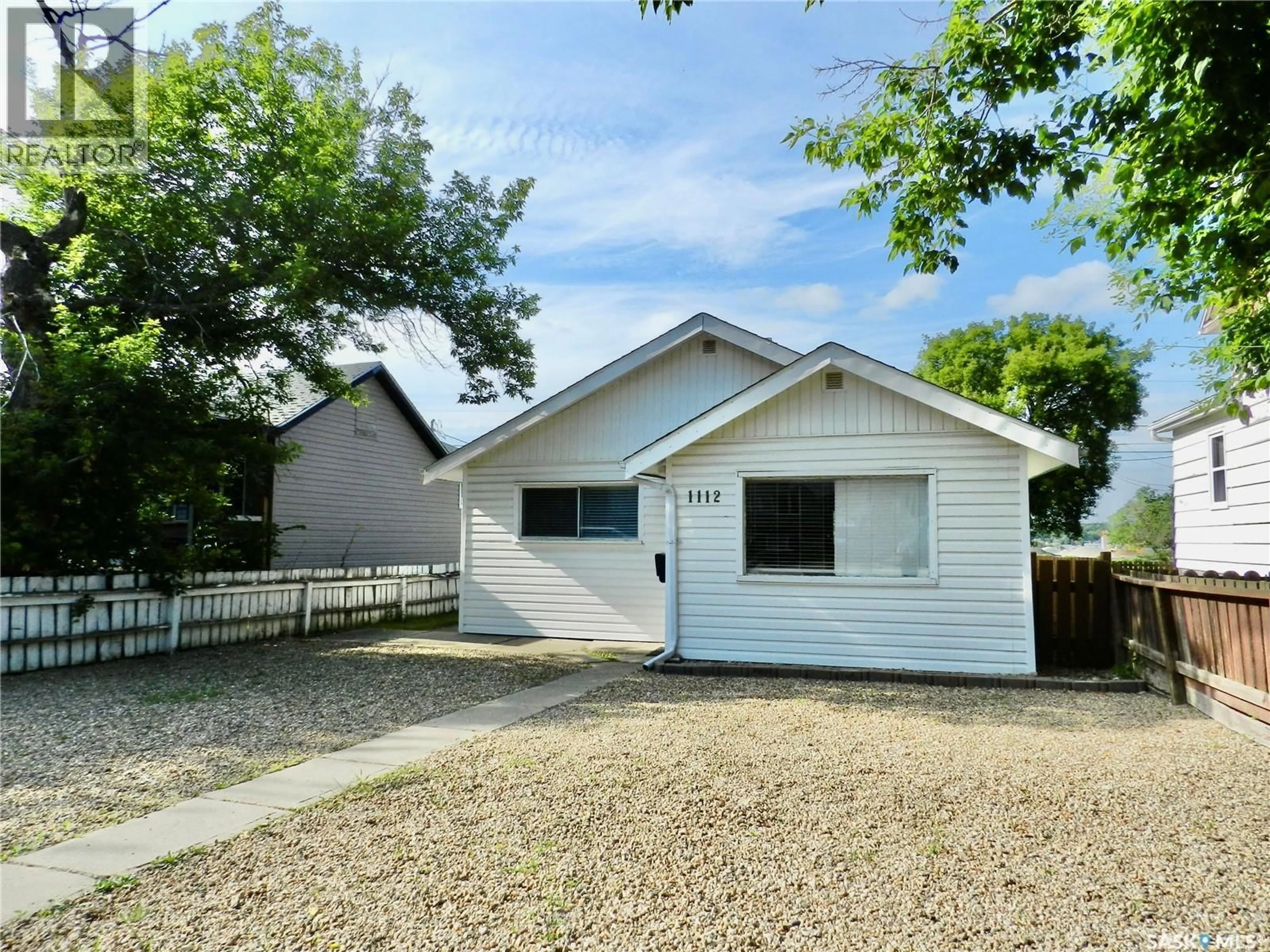 Home with vinyl exterior material, street for 1112 LILLOOET STREET, Moose Jaw Saskatchewan S6H5A3