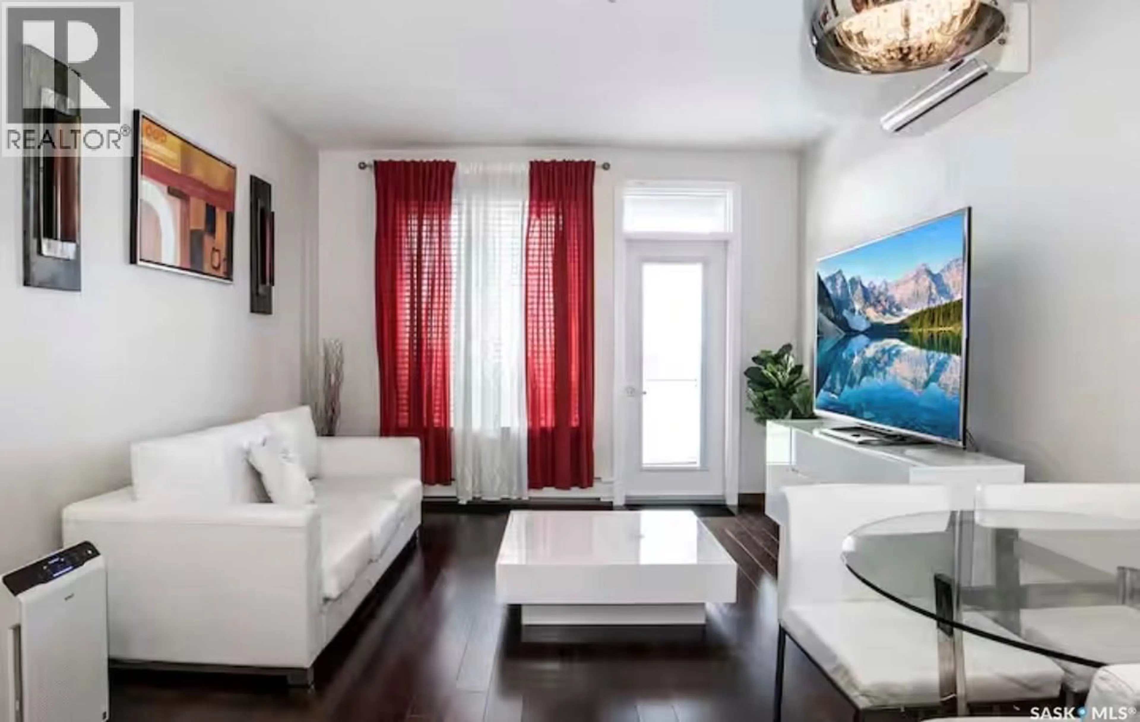 Living room with furniture, wood/laminate floor for 2101 - 313 HESELTINE ROAD, Regina Saskatchewan S4V3H1