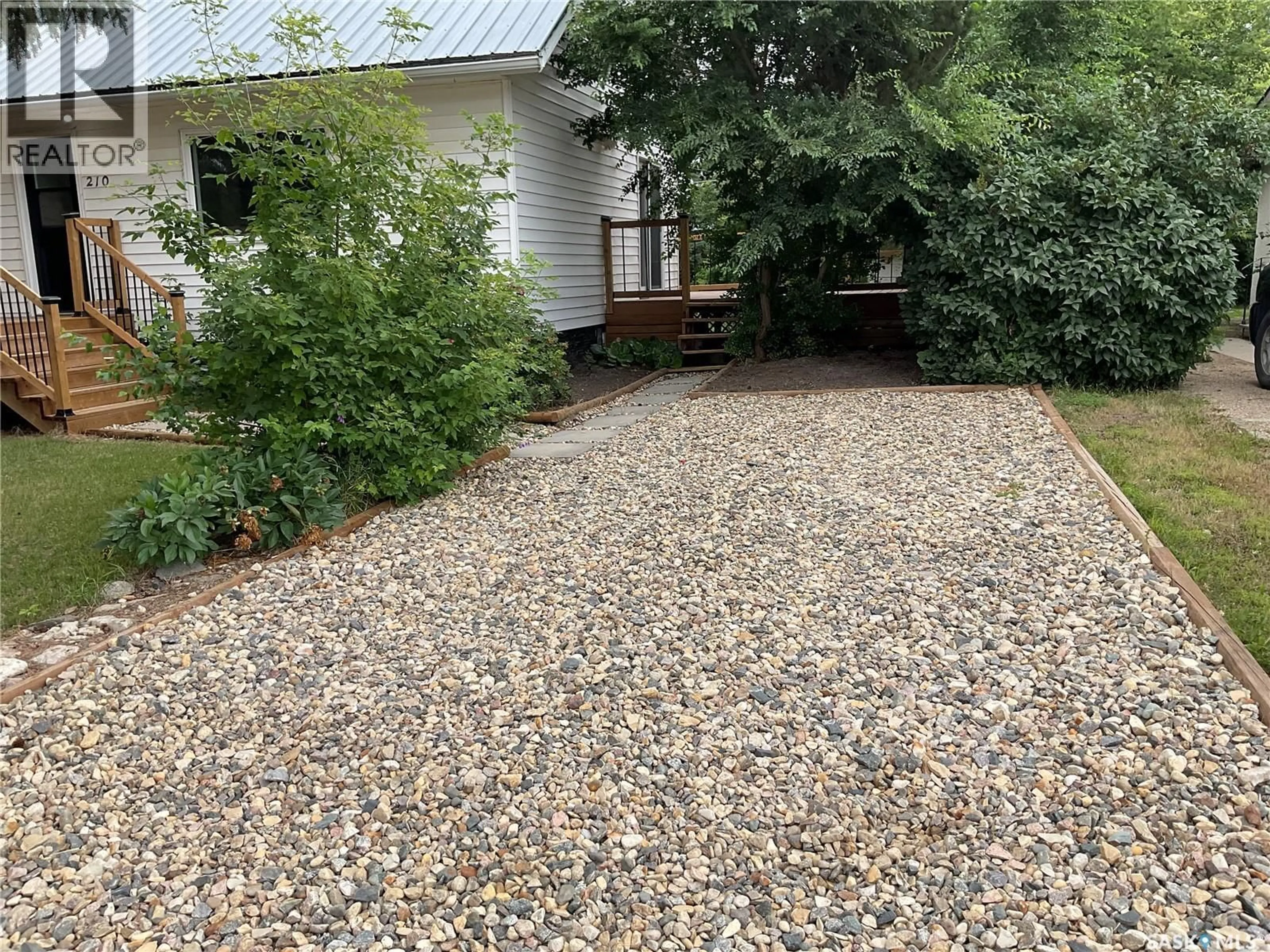 A pic from outside/outdoor area/front of a property/back of a property/a pic from drone, street for S - 210 7TH STREET, Wakaw Saskatchewan S0K4P0