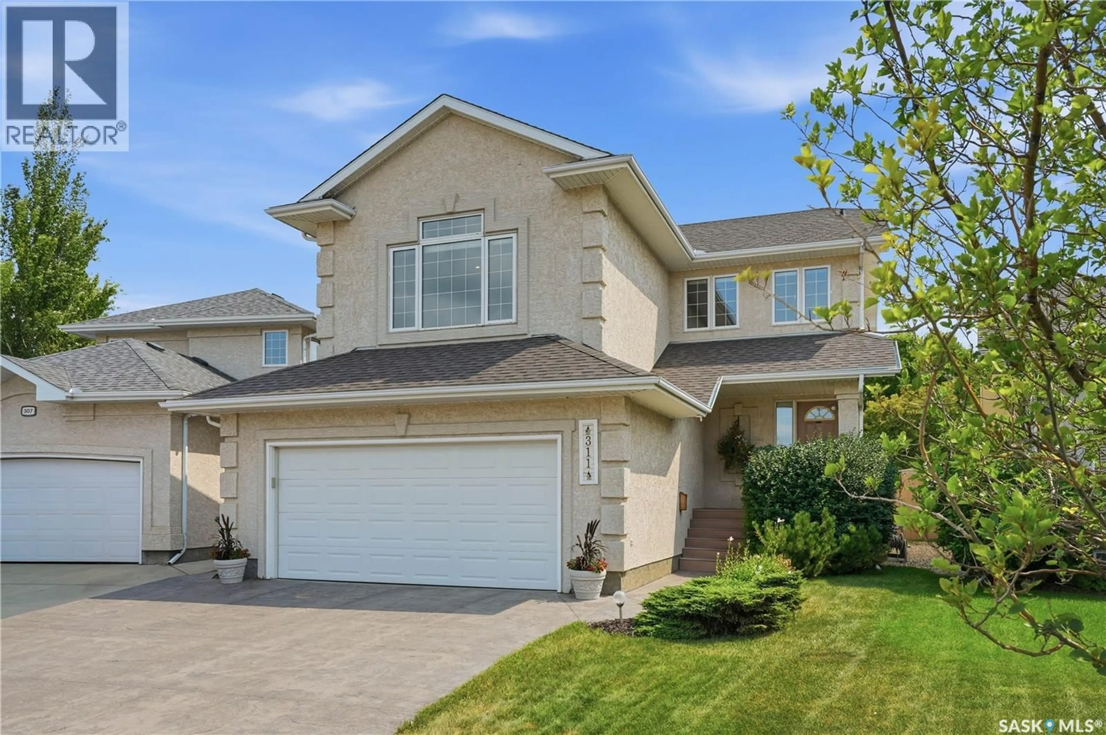Home with vinyl exterior material, street for 311 LASHYN COVE, Saskatoon Saskatchewan S7N4S3