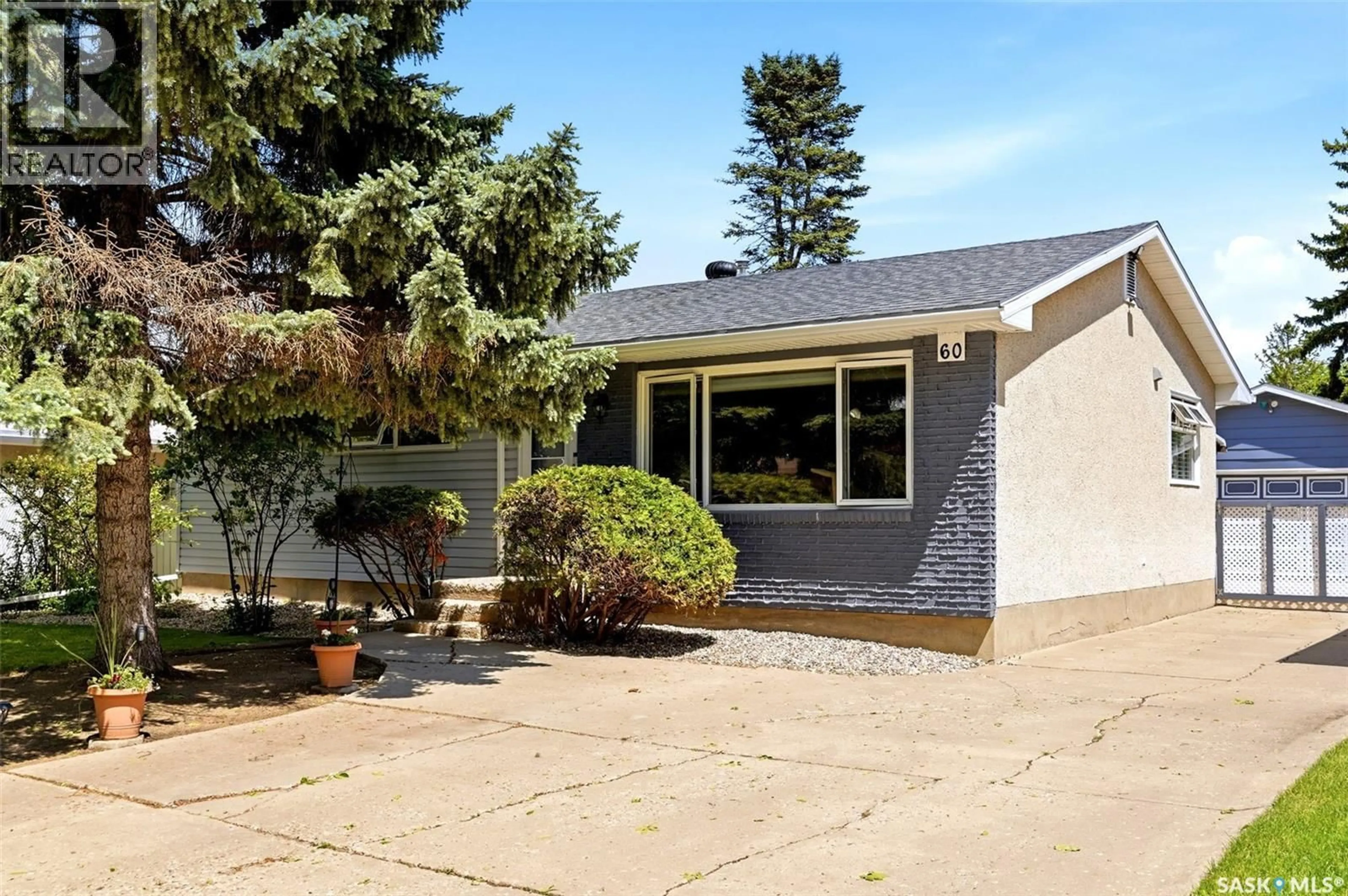 Home with vinyl exterior material, street for 60 KRIVEL CRESCENT, Regina Saskatchewan S4R5C5