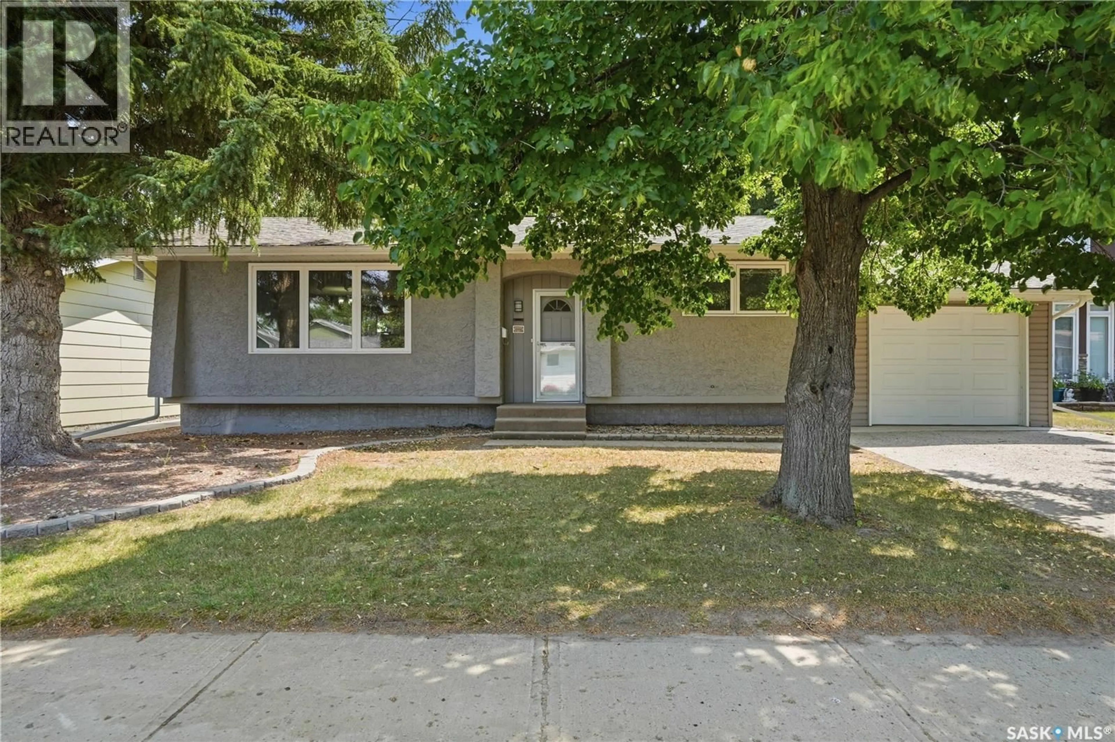 Home with vinyl exterior material, street for 1227 PASCOE DRIVE, Moose Jaw Saskatchewan S6H7A2