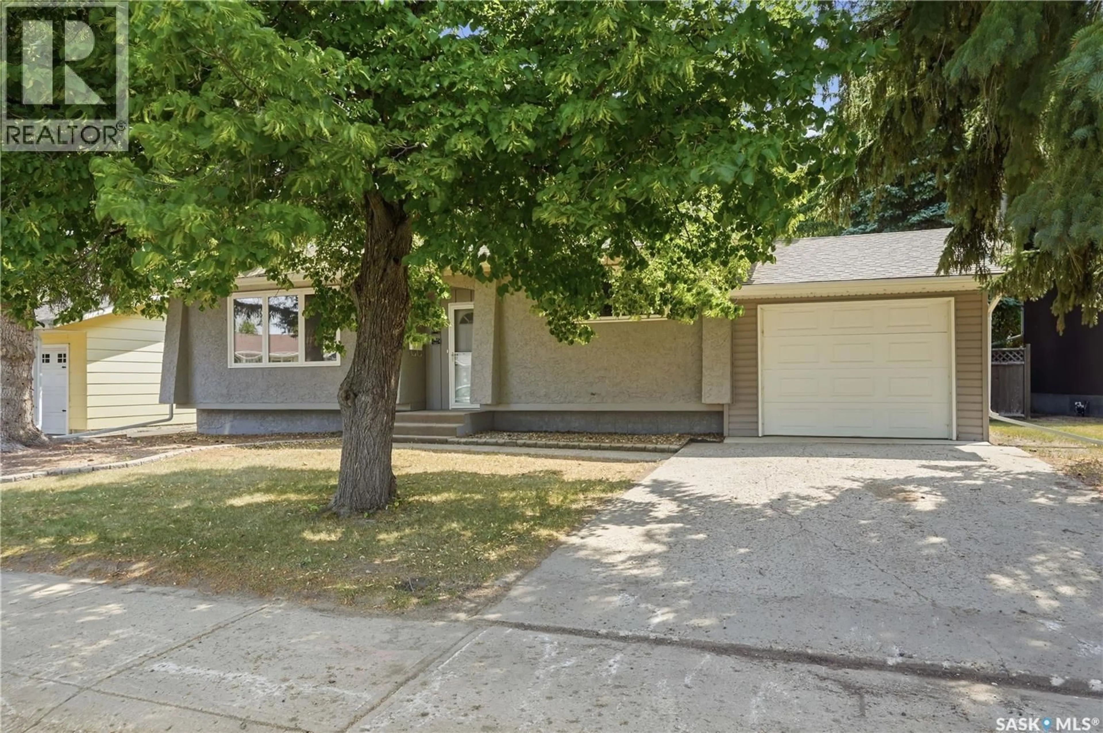 Home with vinyl exterior material, street for 1227 PASCOE DRIVE, Moose Jaw Saskatchewan S6H7A2