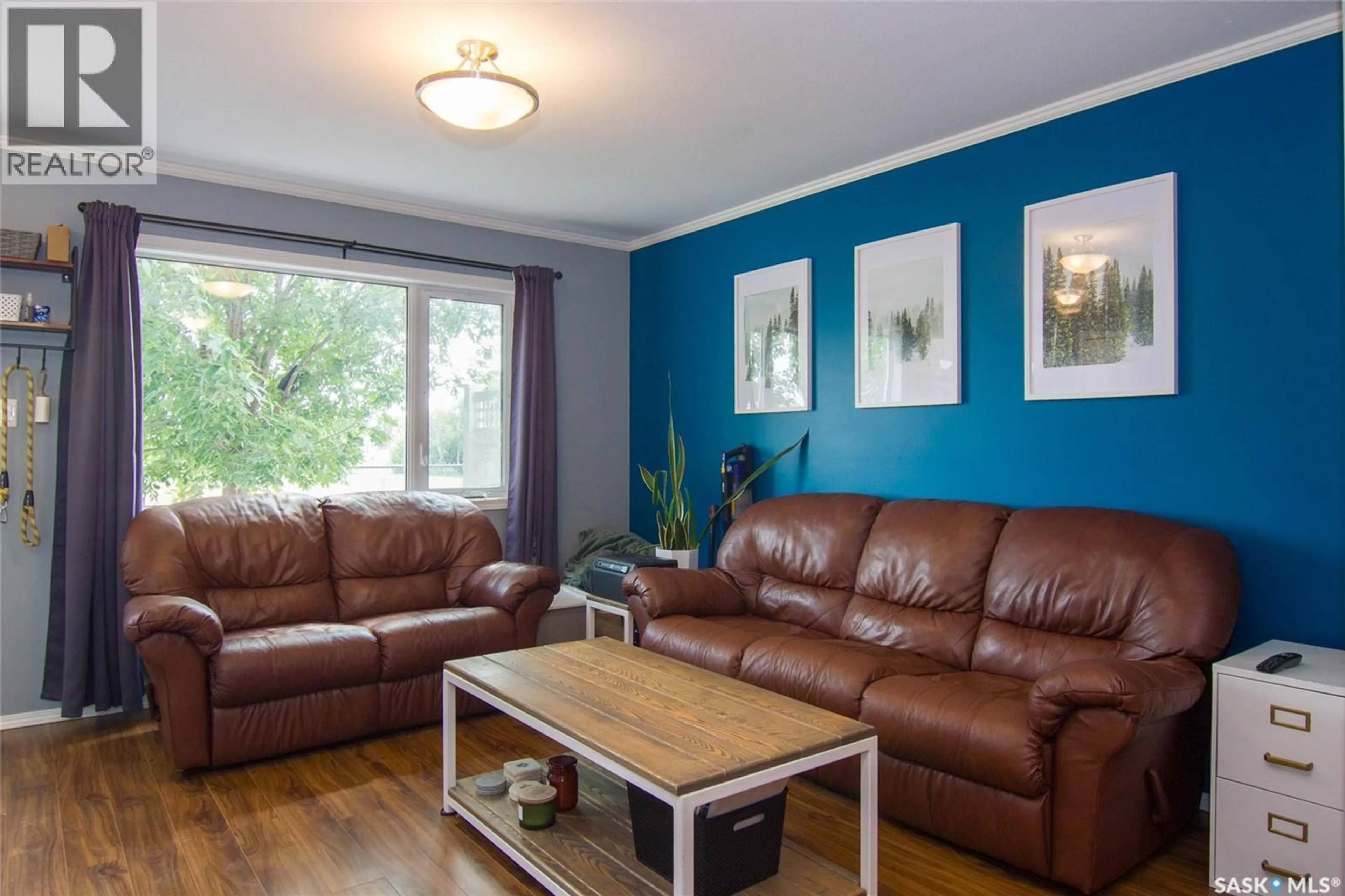 Living room with furniture, wood/laminate floor for 1303 - 603 RICHARDSON ROAD, Saskatoon Saskatchewan S7R0L1