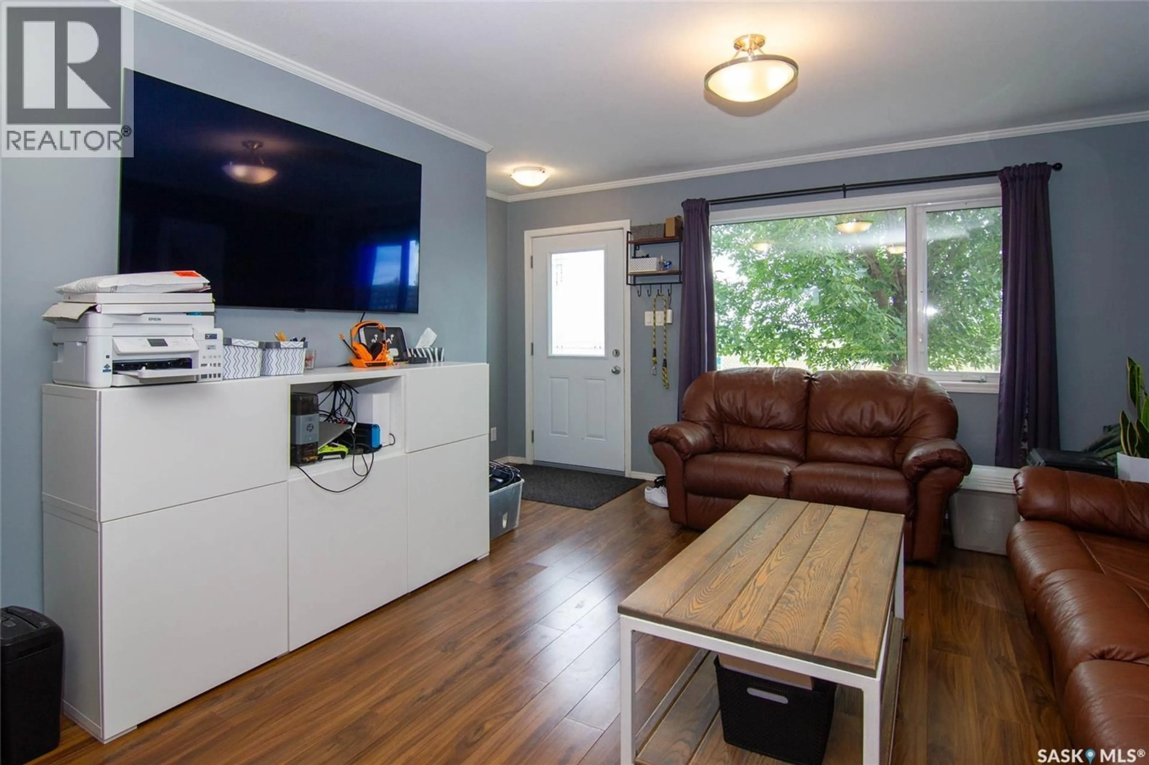 Living room with furniture, wood/laminate floor for 1303 - 603 RICHARDSON ROAD, Saskatoon Saskatchewan S7R0L1