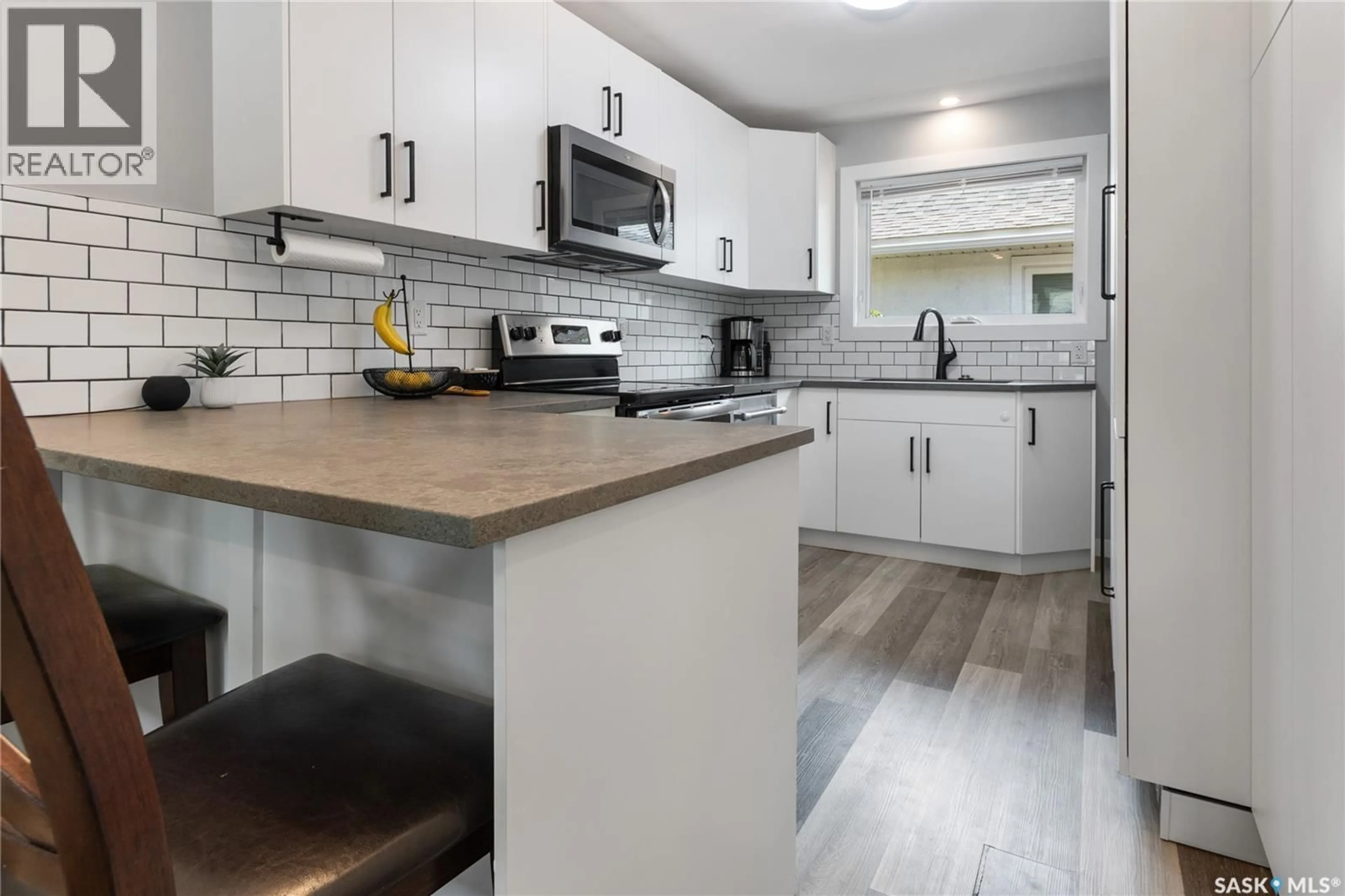 Open concept kitchen, ceramic/tile floor for W - 802 31ST STREET, Saskatoon Saskatchewan S7L0R8