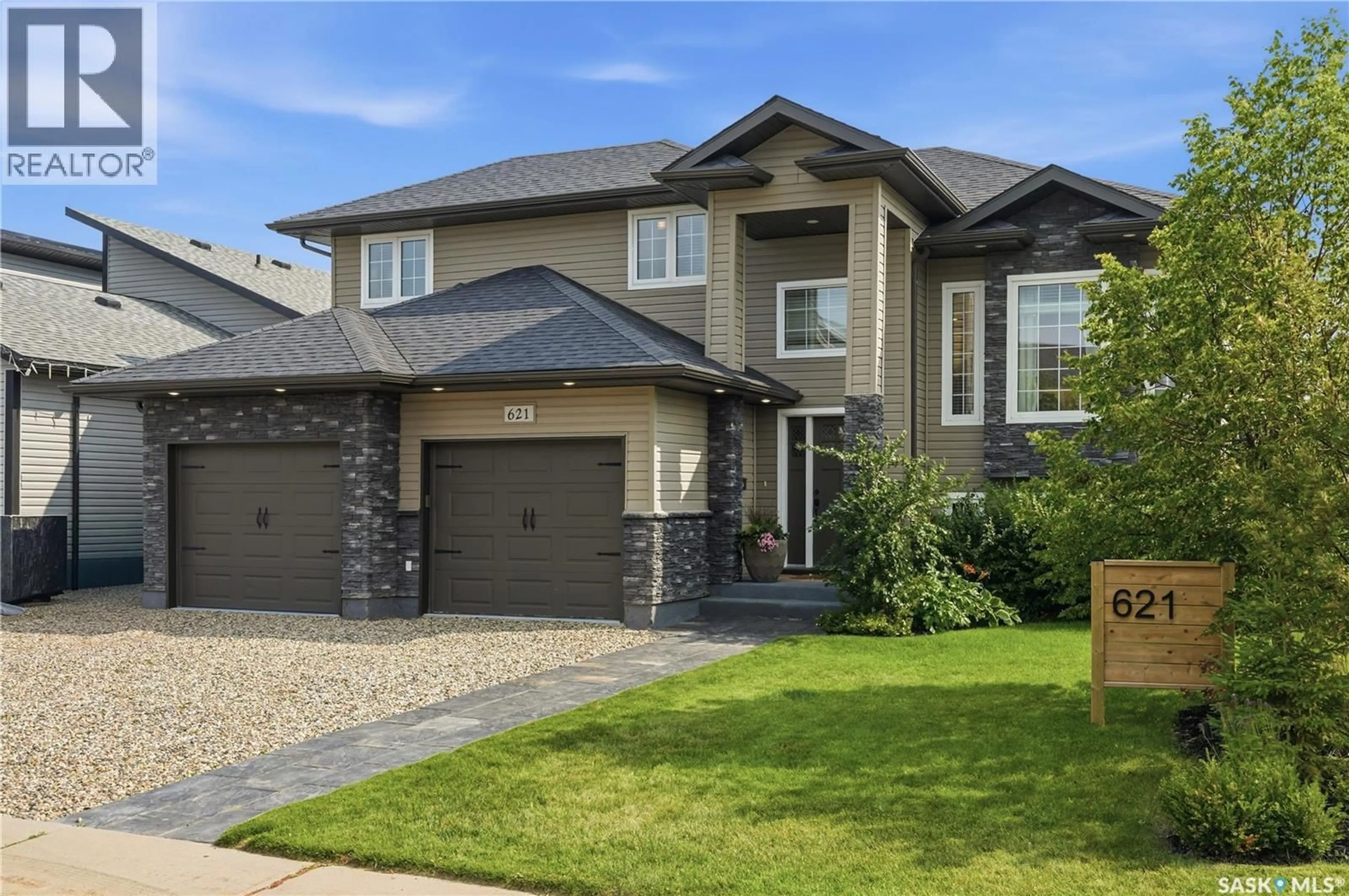 Home with brick exterior material, street for 621 BRAUN LANE, Warman Saskatchewan S0K4S2