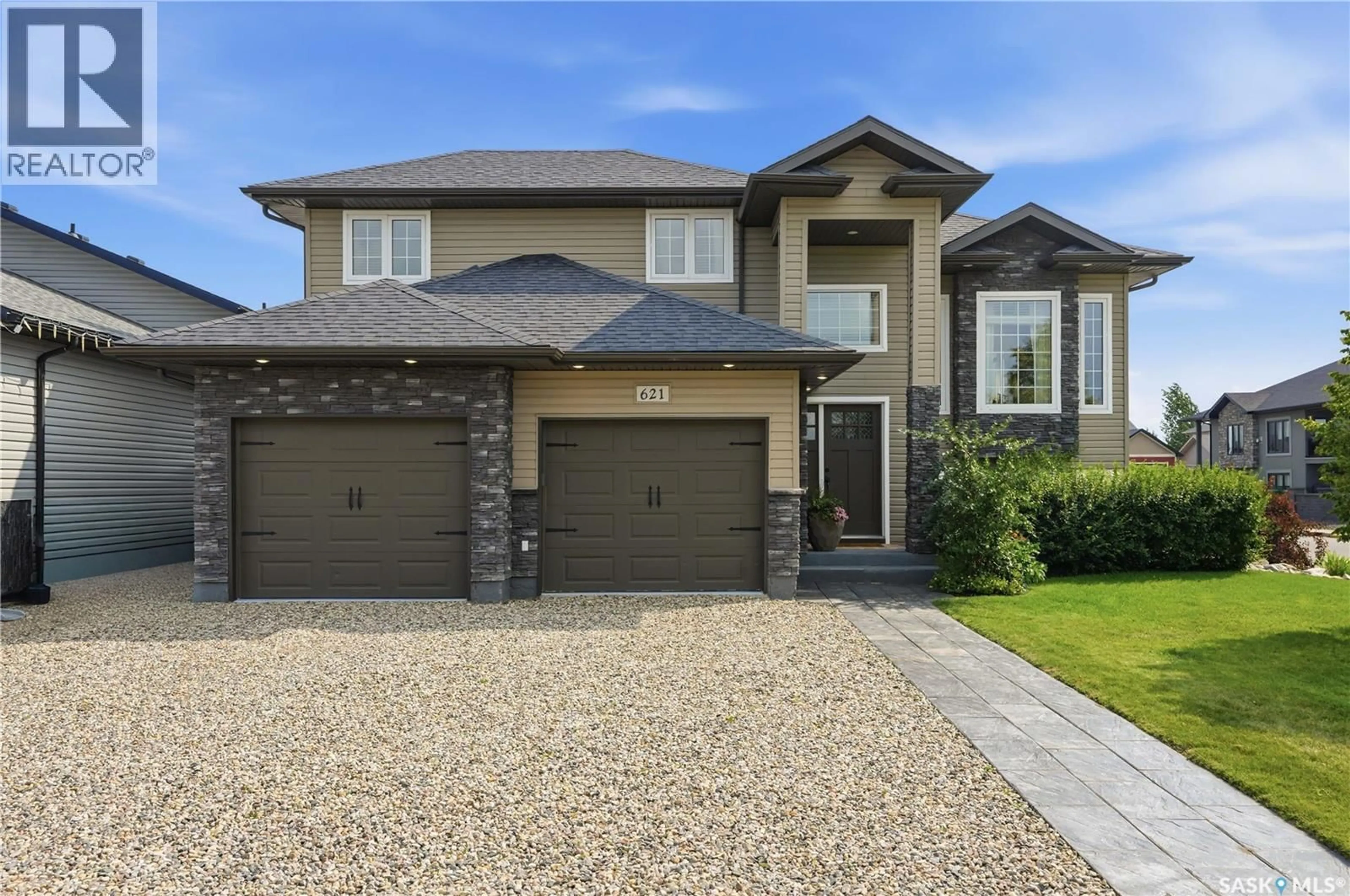 Home with brick exterior material, street for 621 BRAUN LANE, Warman Saskatchewan S0K4S2