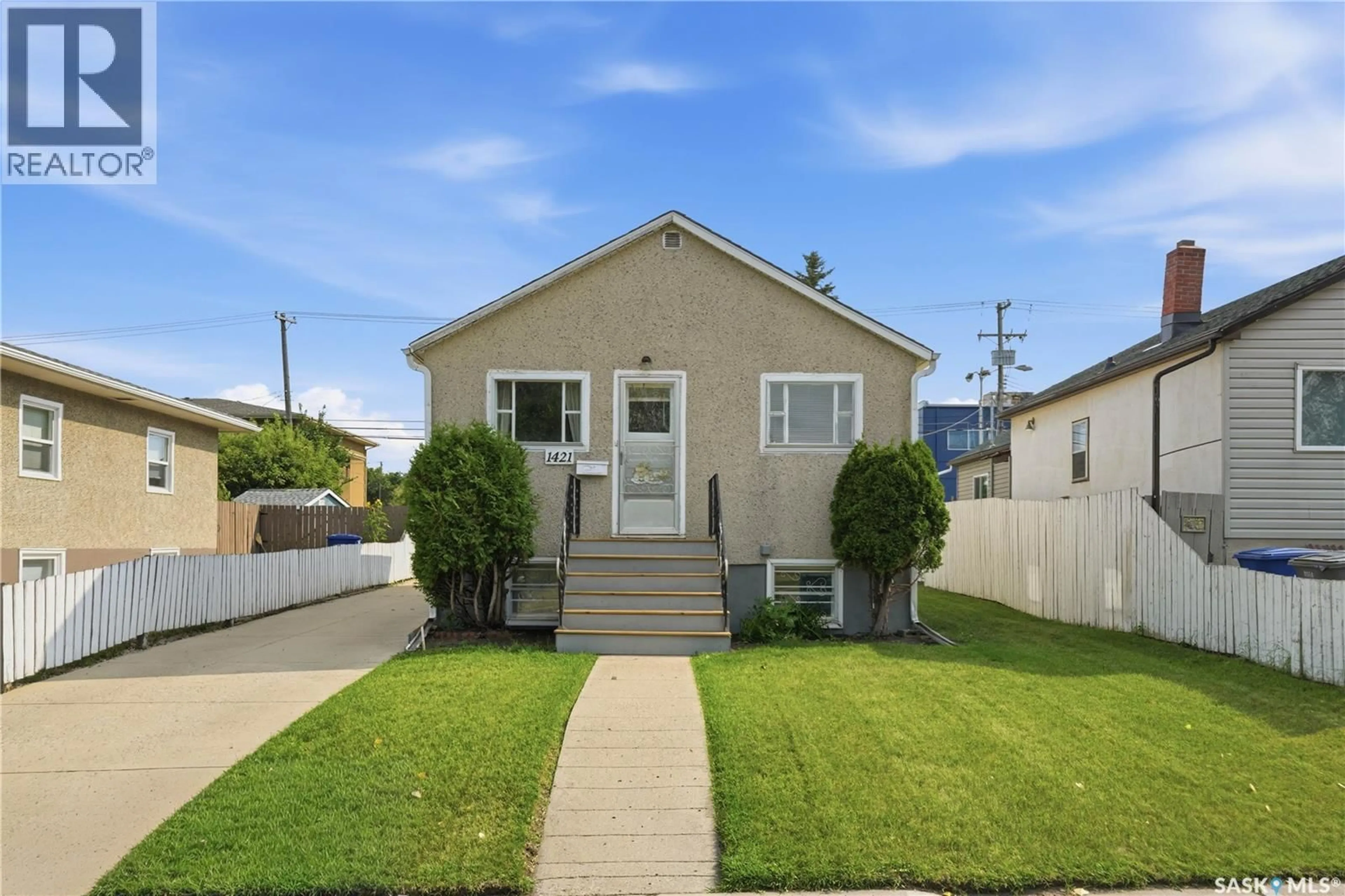 Home with vinyl exterior material, street for 1421 23RD STREET, Saskatoon Saskatchewan S7L0B1