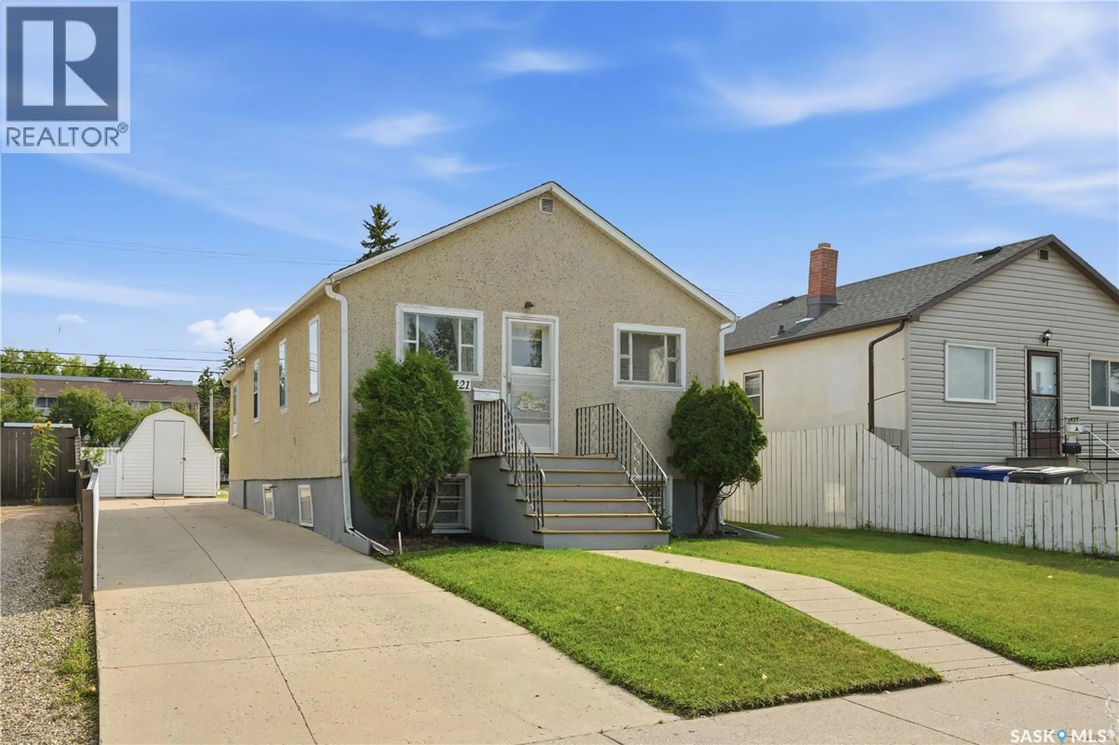 Home with vinyl exterior material, street for 1421 23RD STREET, Saskatoon Saskatchewan S7L0B1