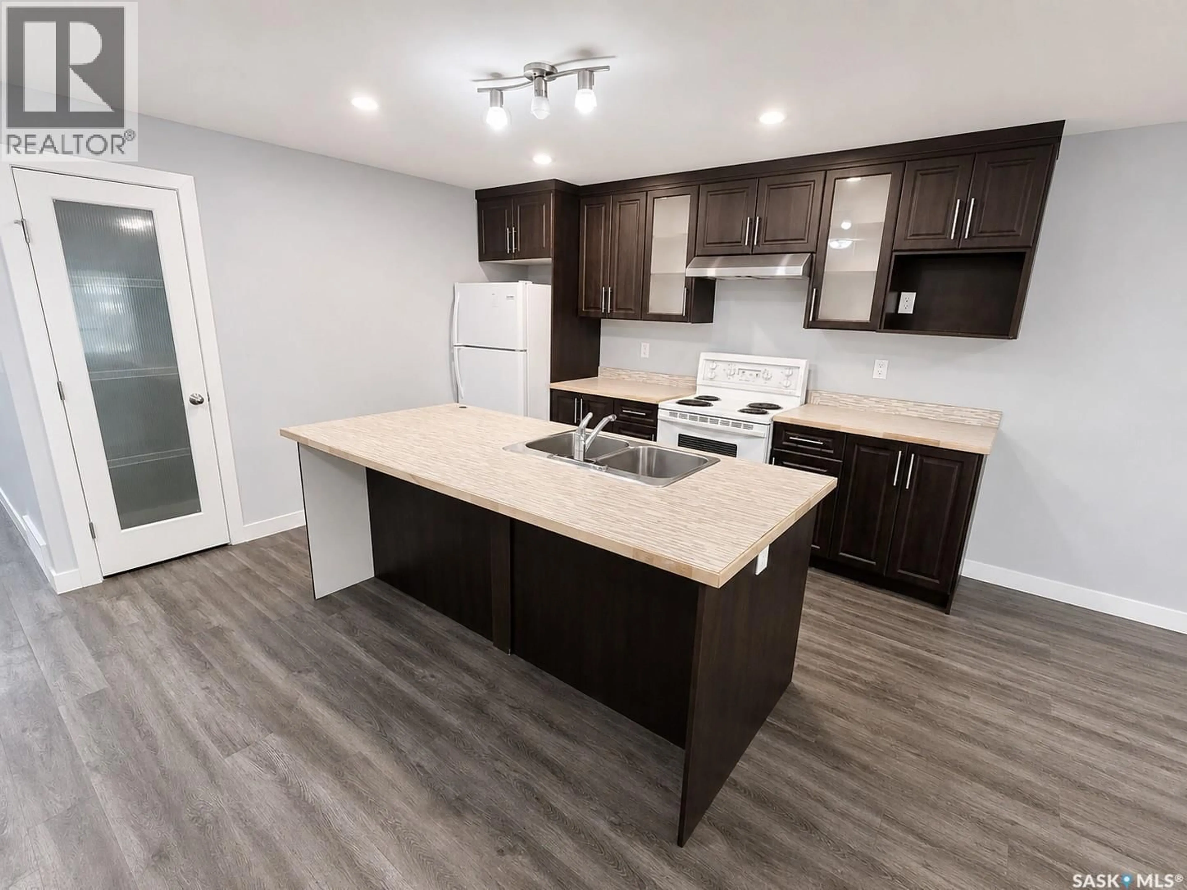 Open concept kitchen, wood/laminate floor for 2264 MONTREAL STREET, Regina Saskatchewan S4P1L6
