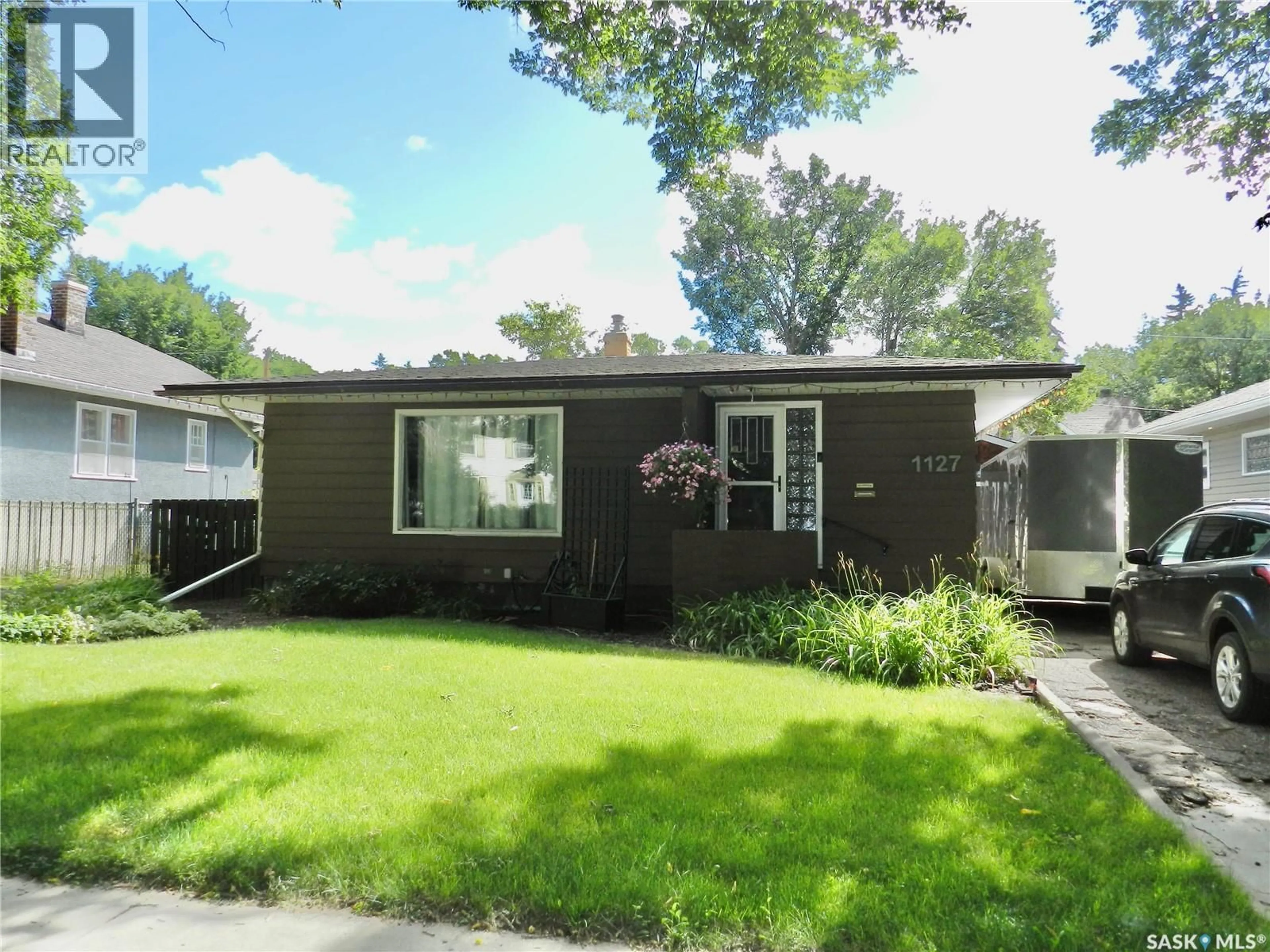 Home with vinyl exterior material, street for 1127 1ST AVENUE, Moose Jaw Saskatchewan S6H3N4