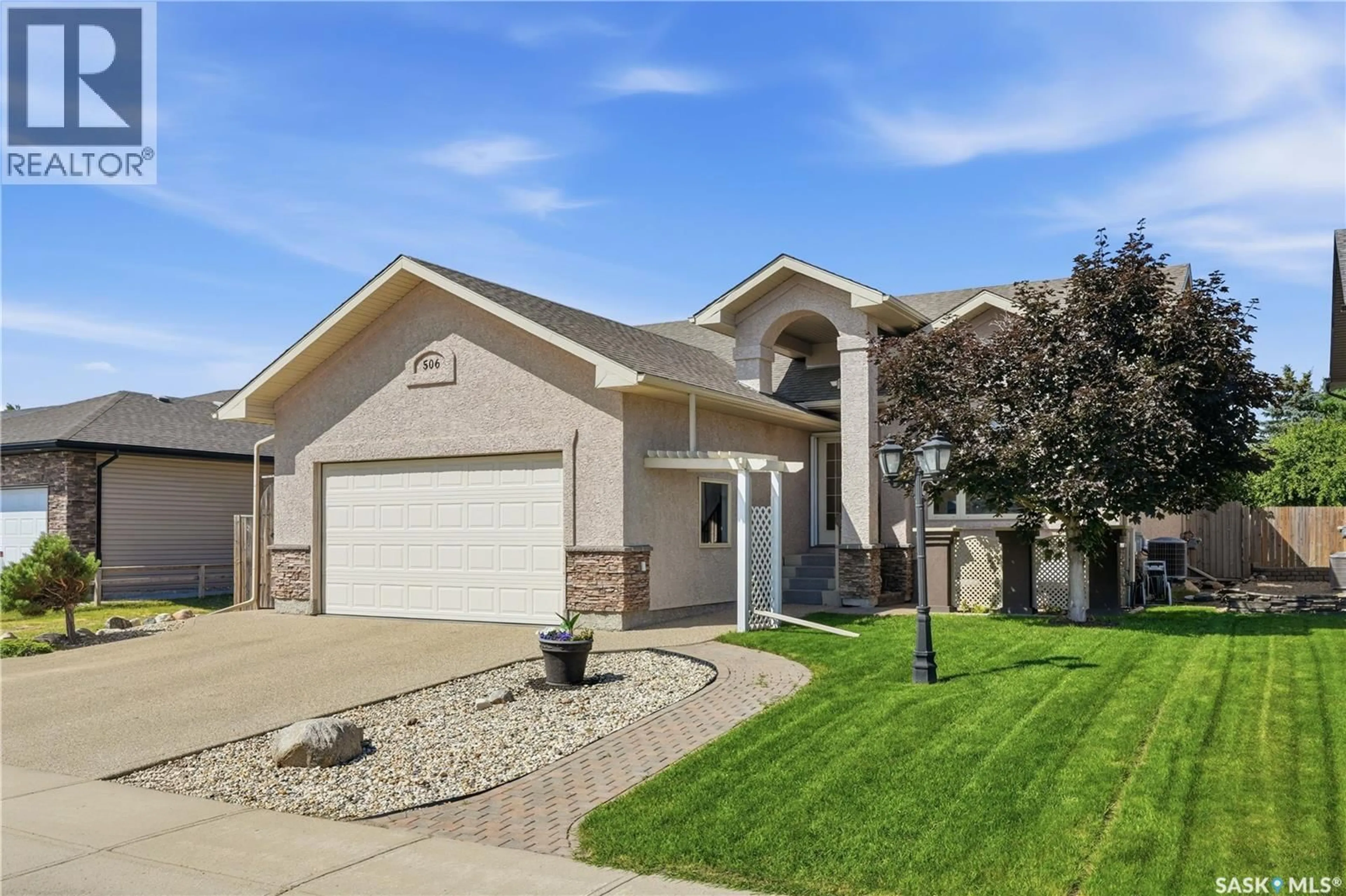 Home with brick exterior material, street for 506 ANTLER CRESCENT, Warman Saskatchewan S0K4S1