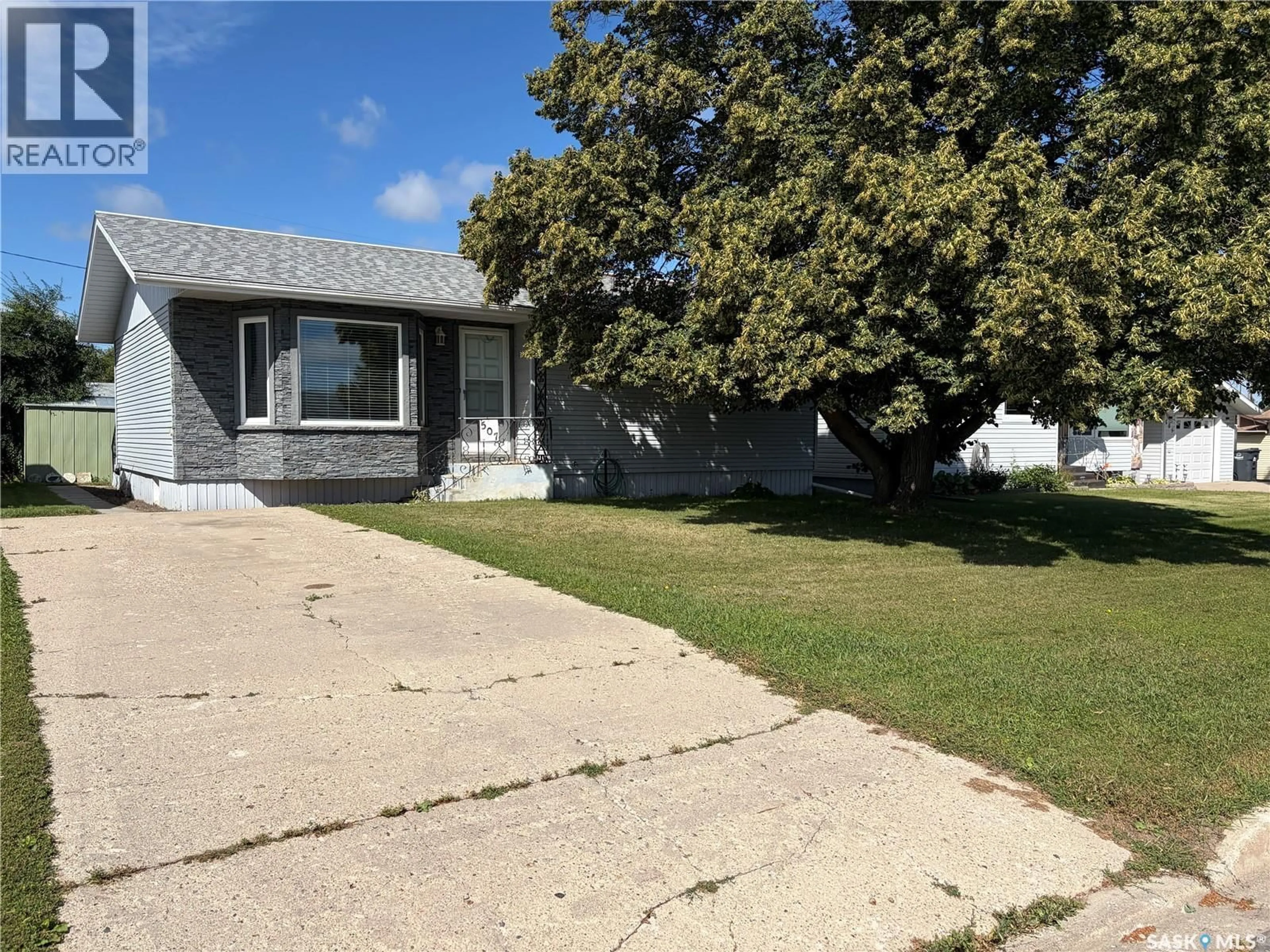 Home with vinyl exterior material, street for 507 6TH STREET, Wynyard Saskatchewan S0A4T0