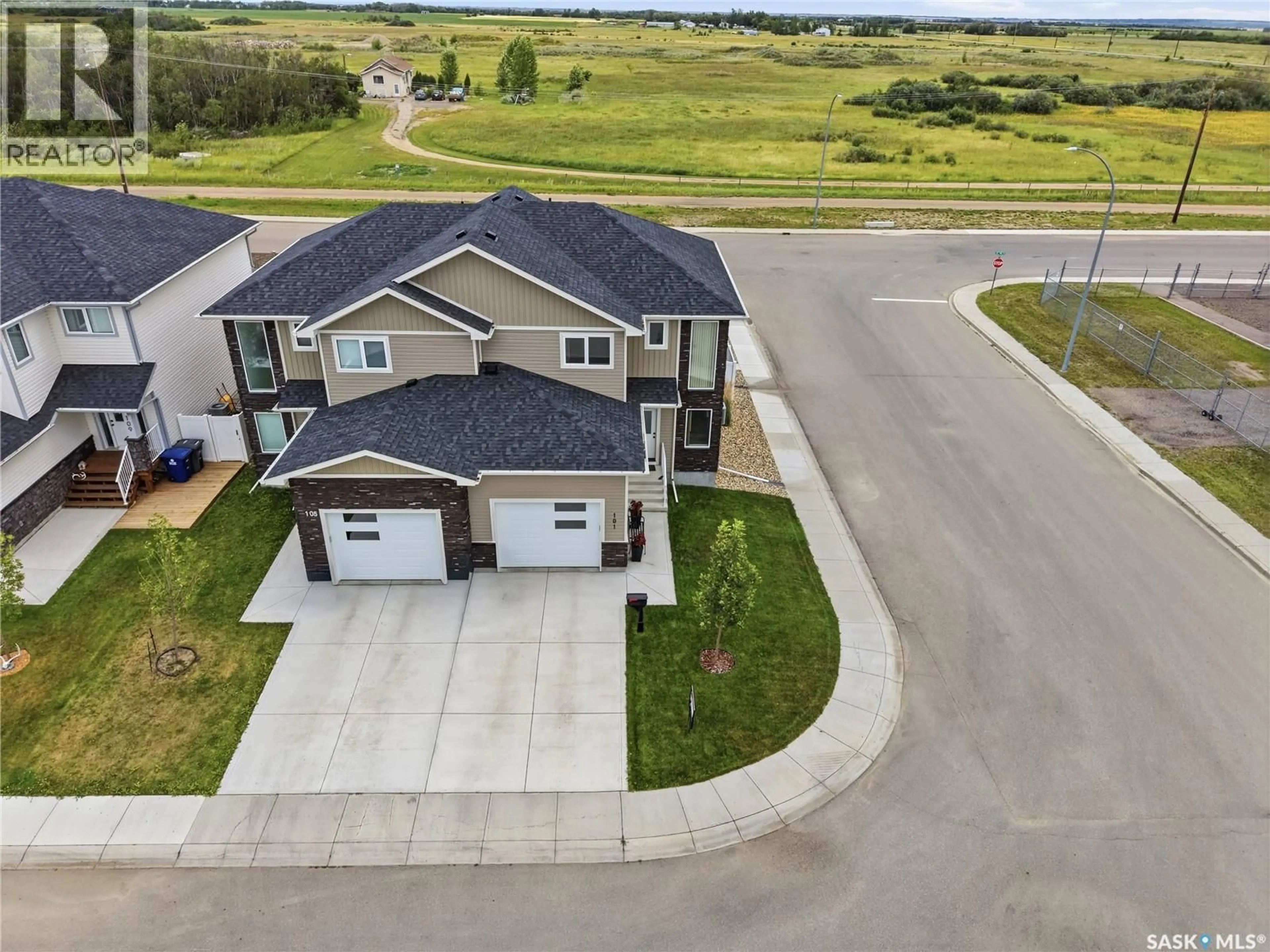 A pic from outside/outdoor area/front of a property/back of a property/a pic from drone, street for 101 ECHO LANE, Martensville Saskatchewan S0K2T1