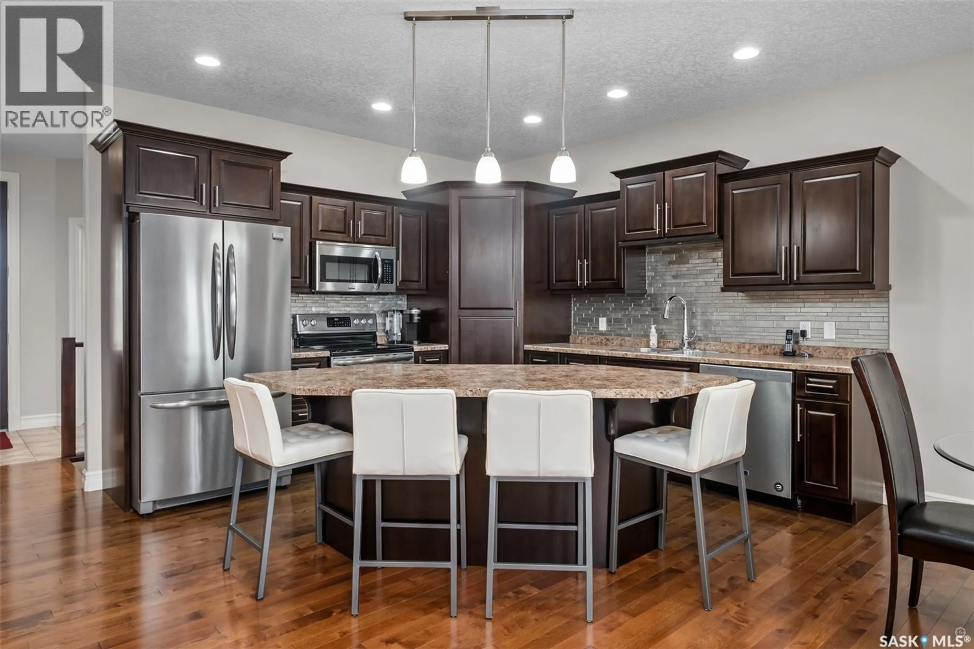 Open concept kitchen, wood/laminate floor for 15 2805 LAKEVIEW DRIVE, Prince Albert Saskatchewan S6W0A4