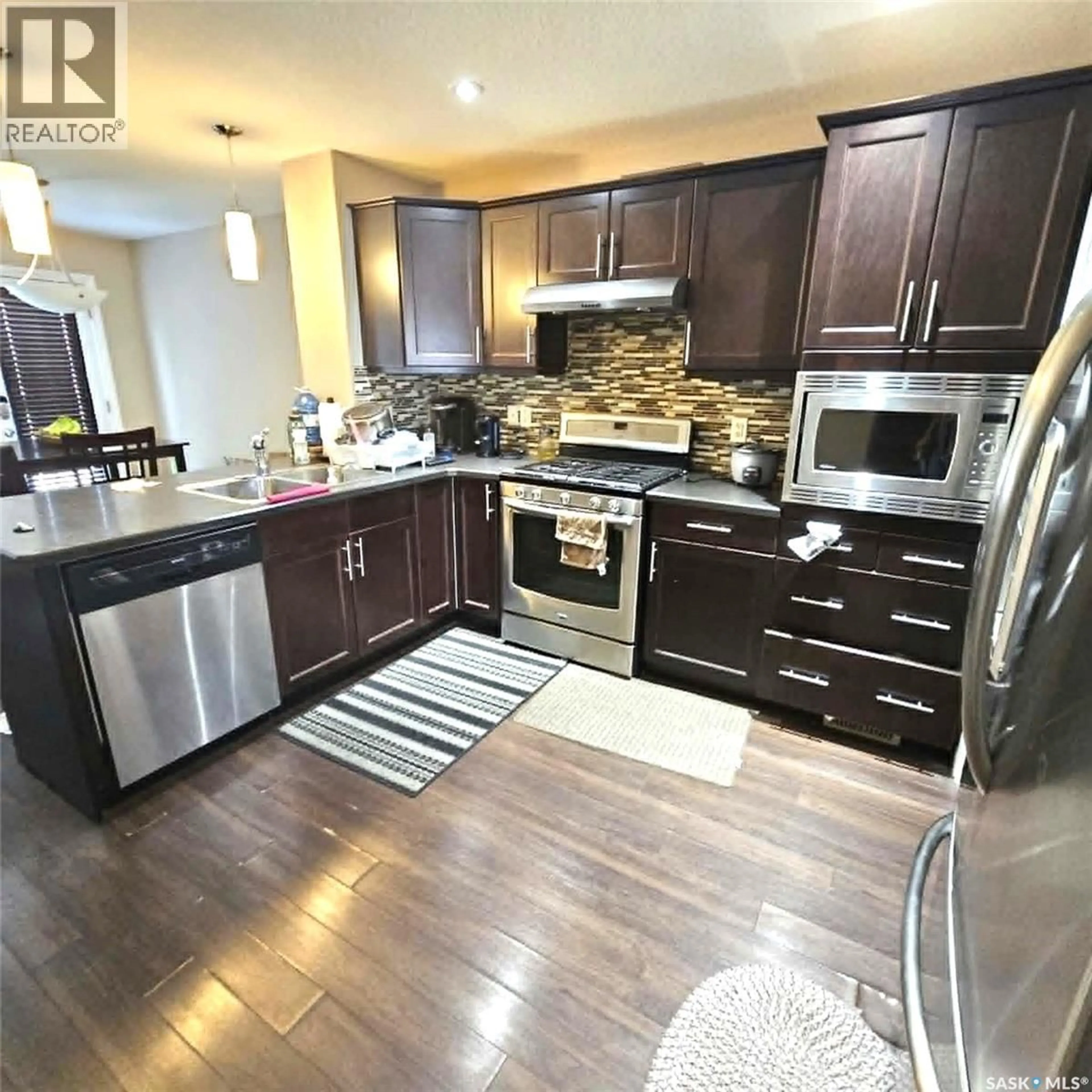 Open concept kitchen, unknown for 5008 AERIAL CRESCENT, Regina Saskatchewan S4W0C9