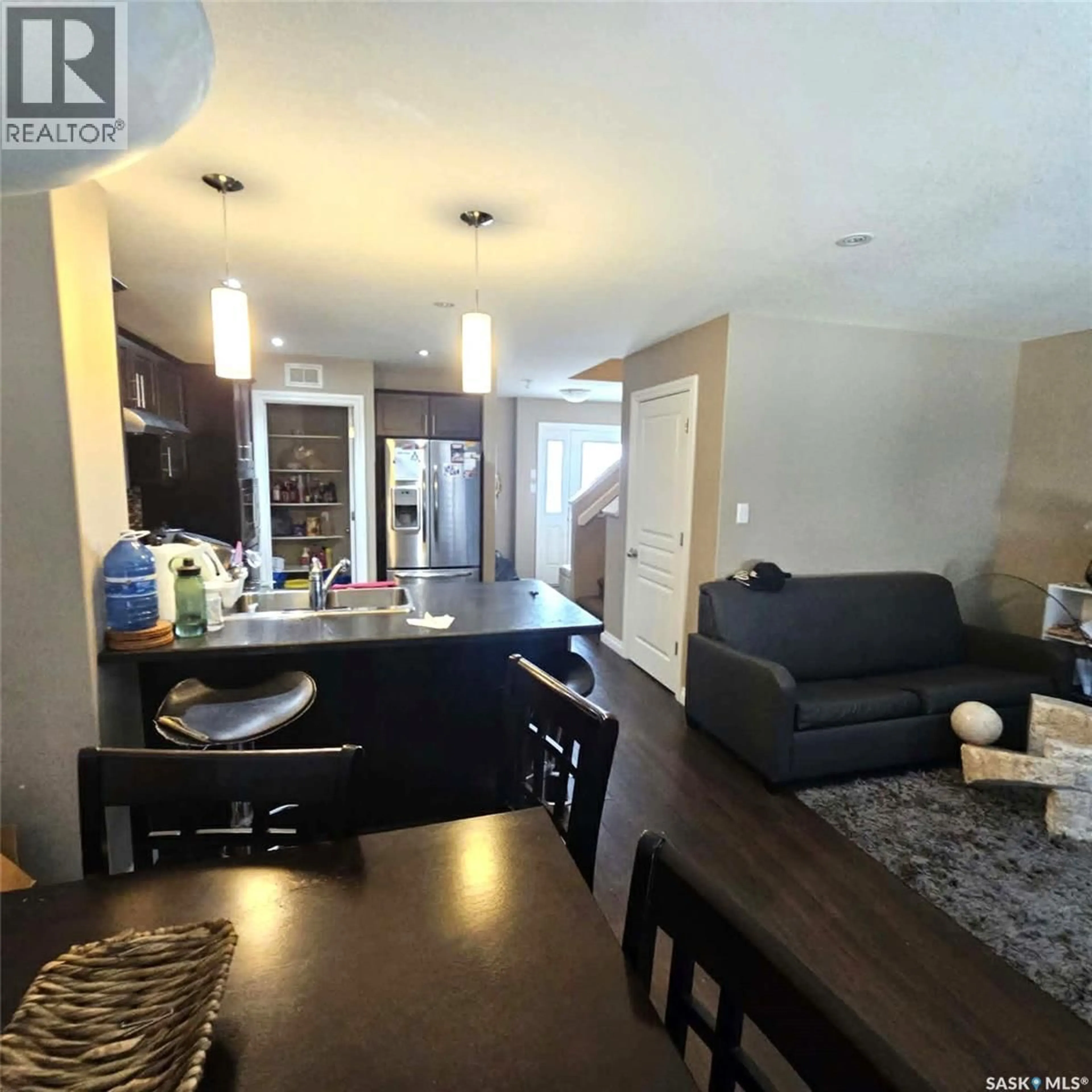 Open concept kitchen, wood/laminate floor for 5008 AERIAL CRESCENT, Regina Saskatchewan S4W0C9