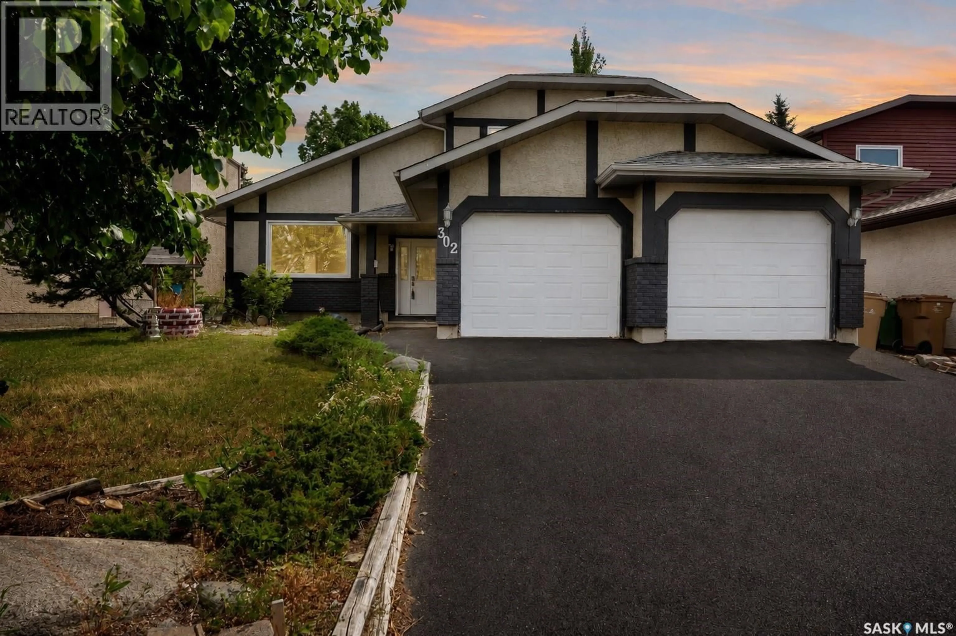 Home with vinyl exterior material, street for 302 DOIRON ROAD, Regina Saskatchewan S4Y1G1