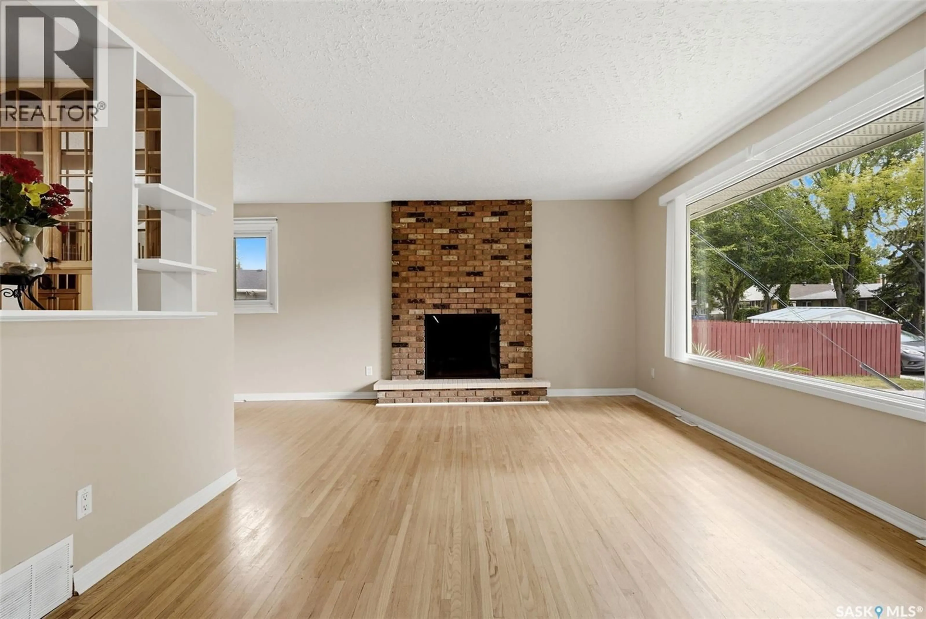 Living room with furniture, wood/laminate floor for 202 MCCANNEL STREET, Regina Saskatchewan S4R3V1