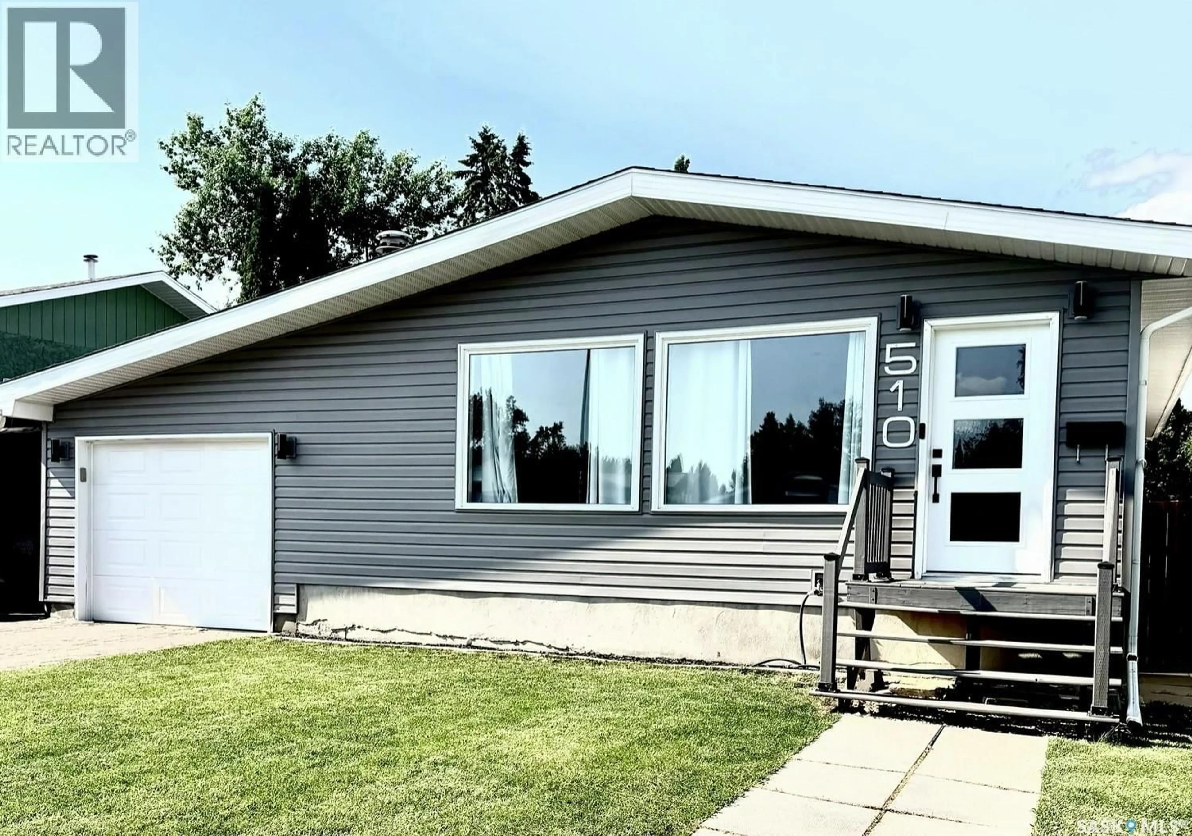 Home with vinyl exterior material, street for 510 REDBERRY ROAD, Saskatoon Saskatchewan S7K4S3