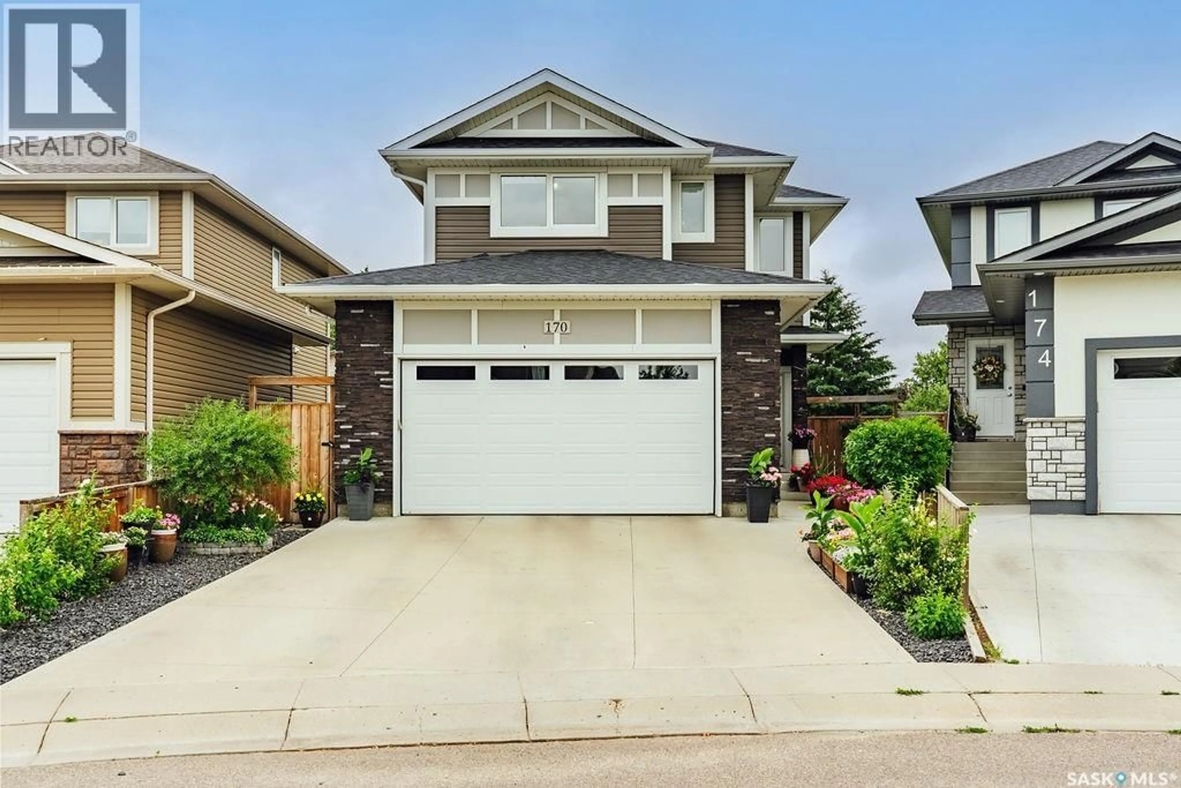 Home with vinyl exterior material, street for 170 PALLISER COURT, Saskatoon Saskatchewan S7L4P9