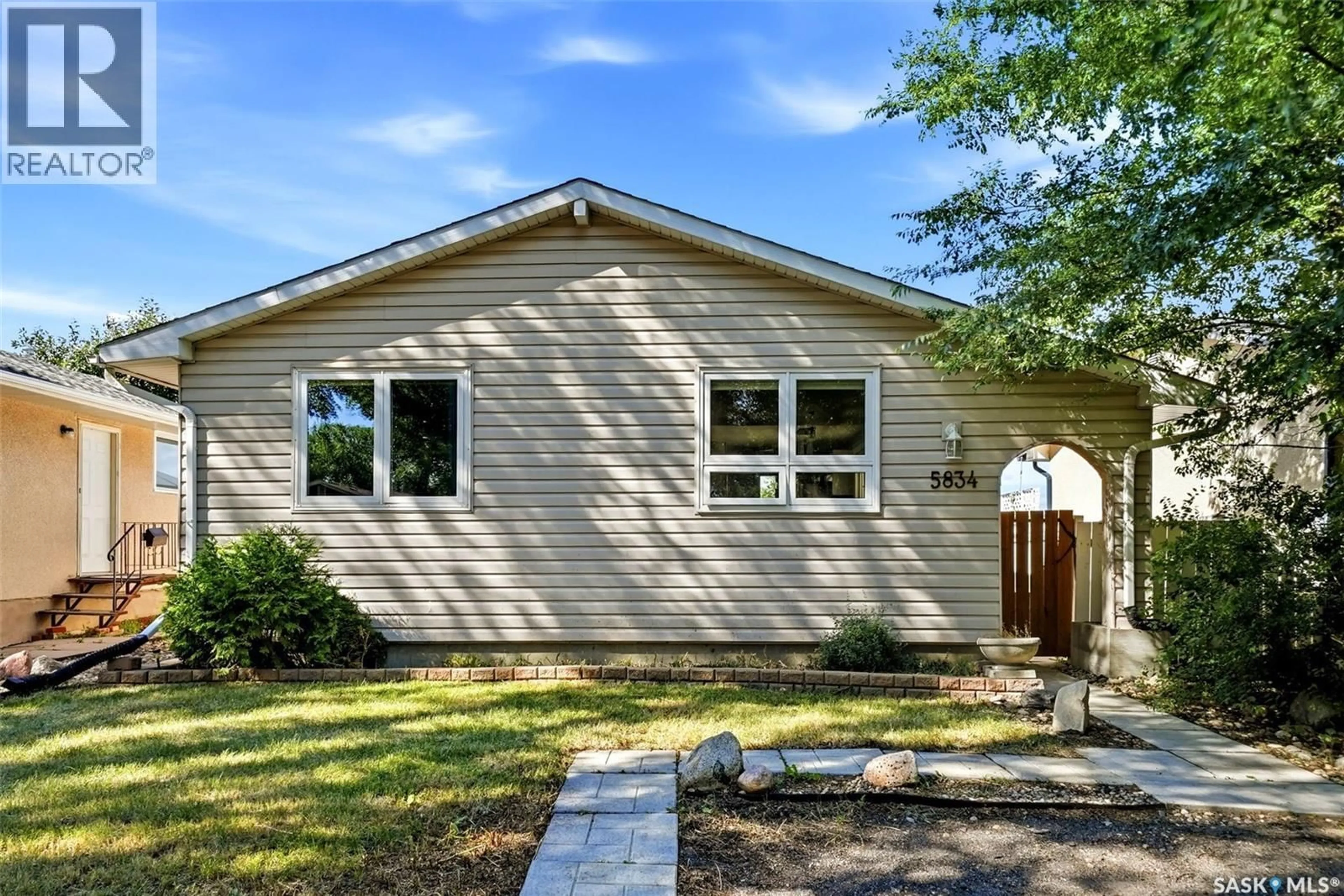 Home with vinyl exterior material, street for 5834 MCKINLEY AVENUE, Regina Saskatchewan S4T6P3