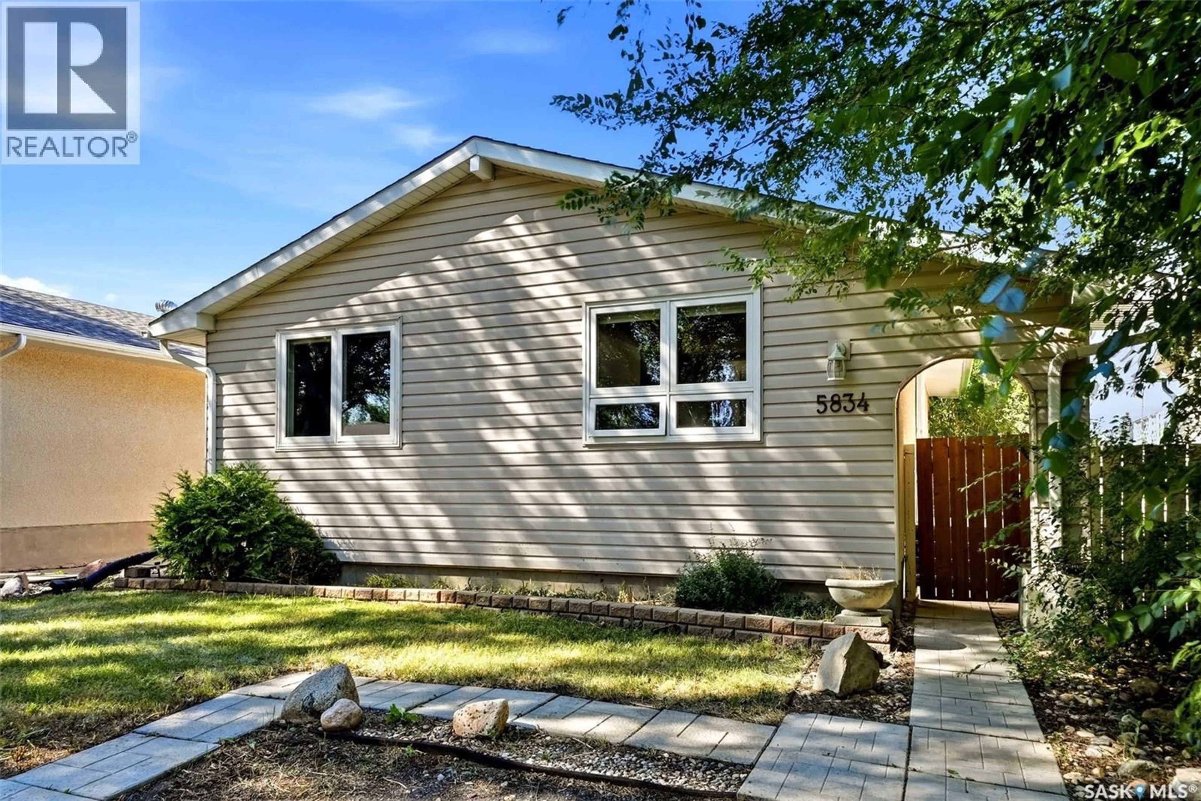 Home with vinyl exterior material, street for 5834 MCKINLEY AVENUE, Regina Saskatchewan S4T6P3
